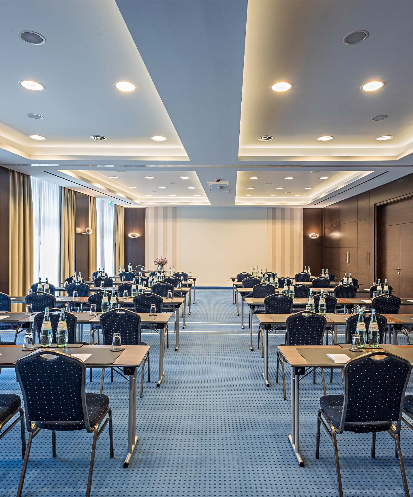 Pestana Berlin, central hotel in Berlin next to Tiergarten, has a meeting room with several chairs and tables