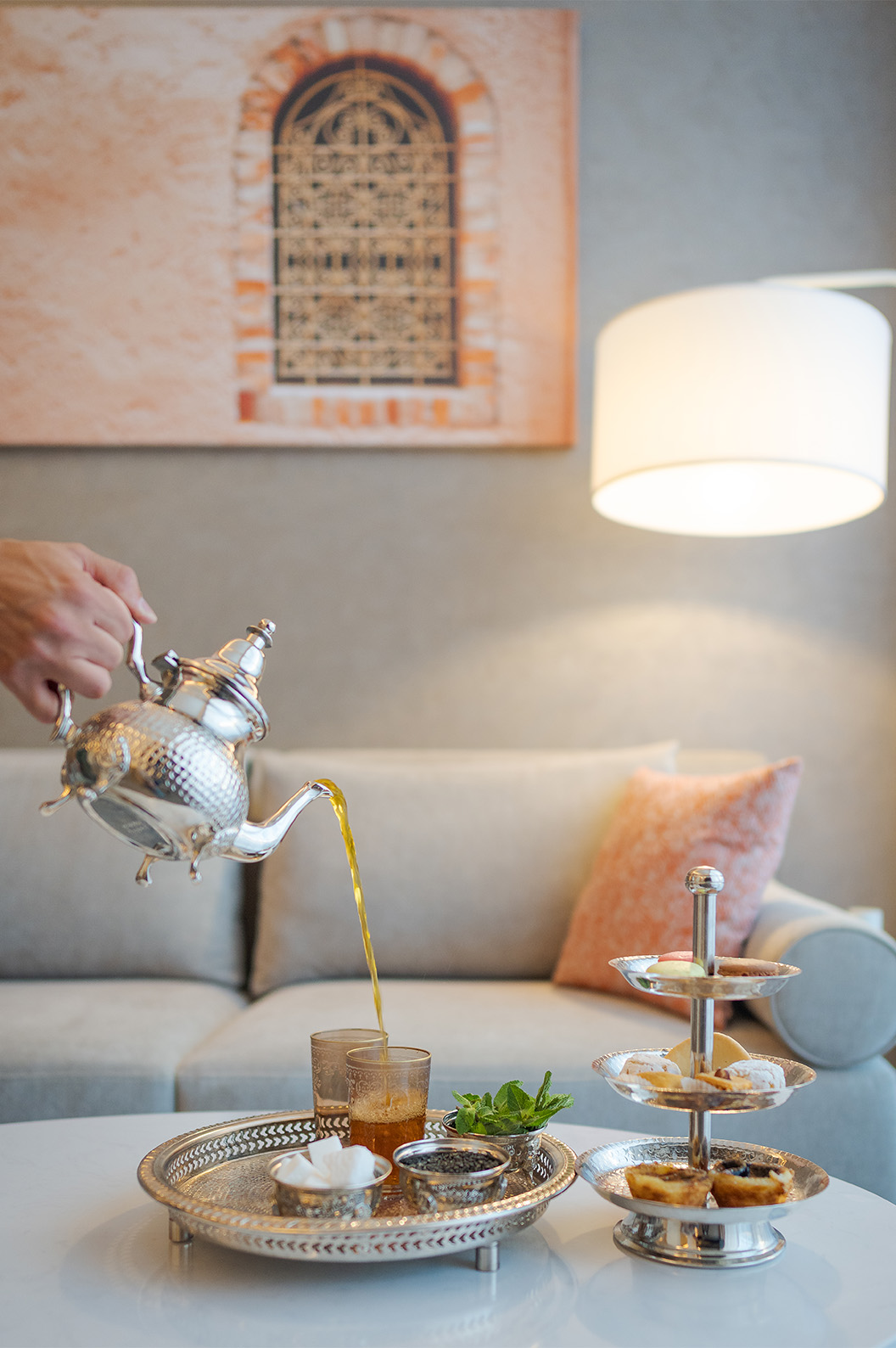 Tea and traditional cakes served on a silver tray at Lifestyle Hotel in Morocco with pool