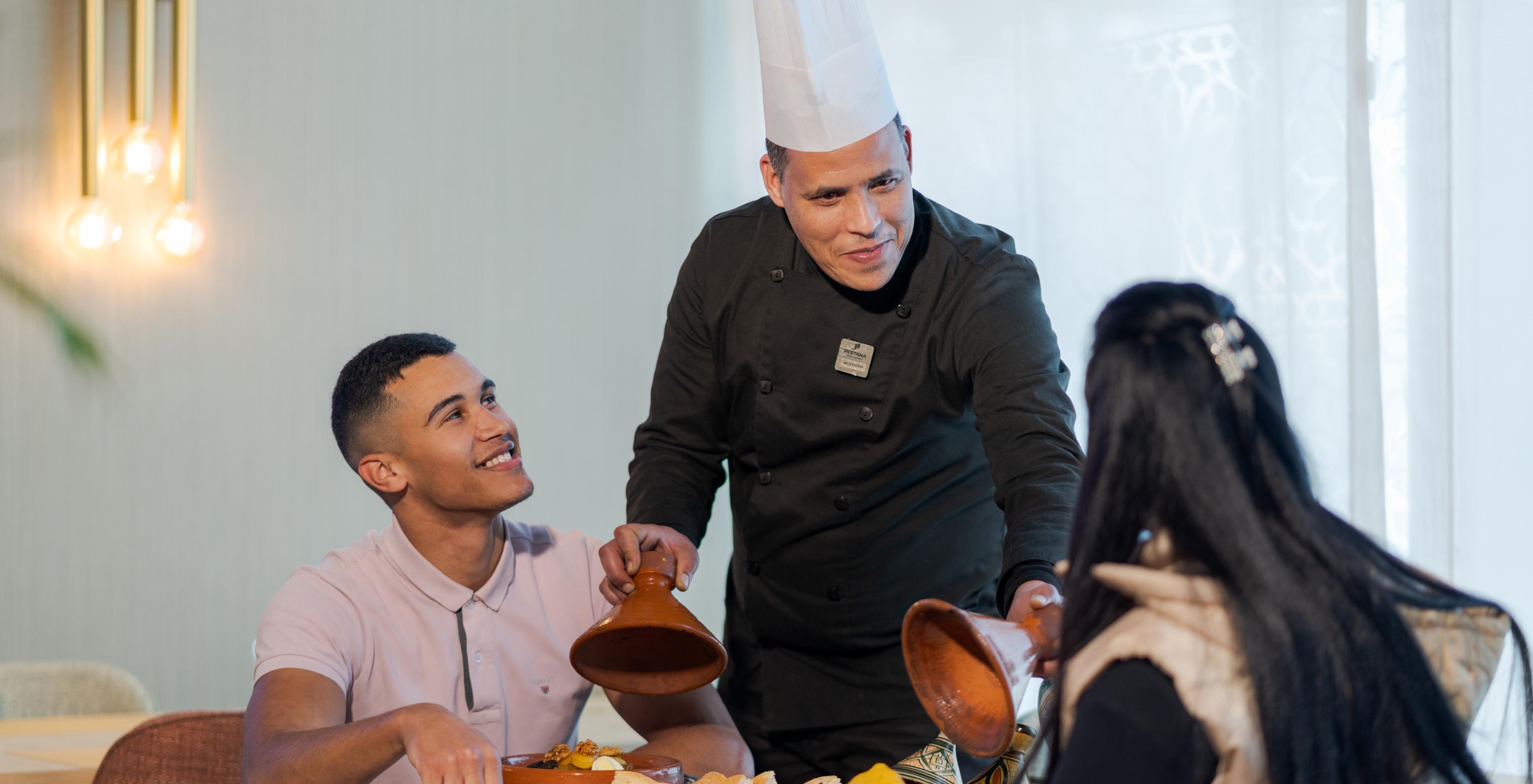 Pestana Tanger City Center, with Suites and Apartments in Tangier, has a chef presenting dishes to guests