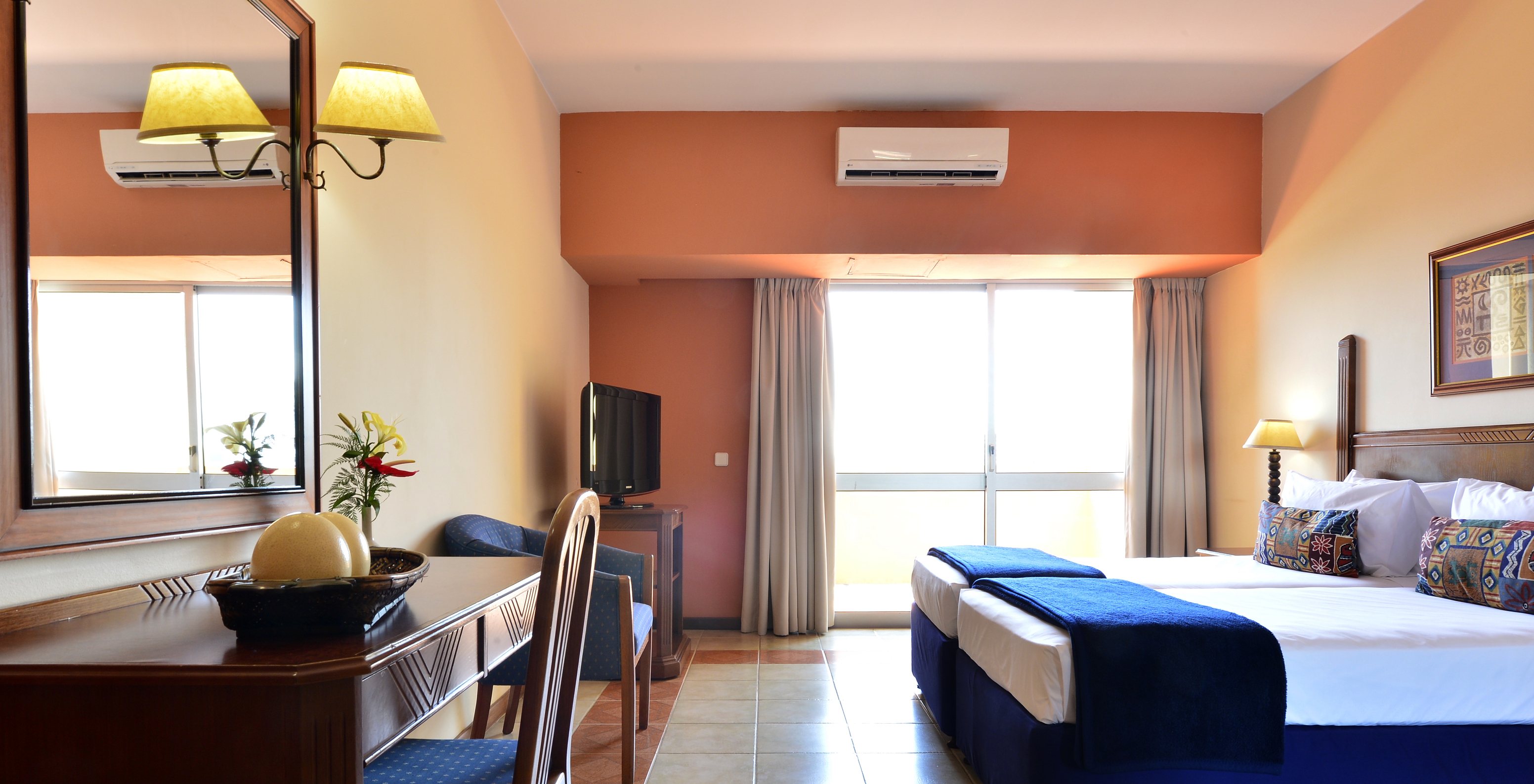 The Executive Double of Pestana Rovuma has two single beds, a desk, television, and air conditioning