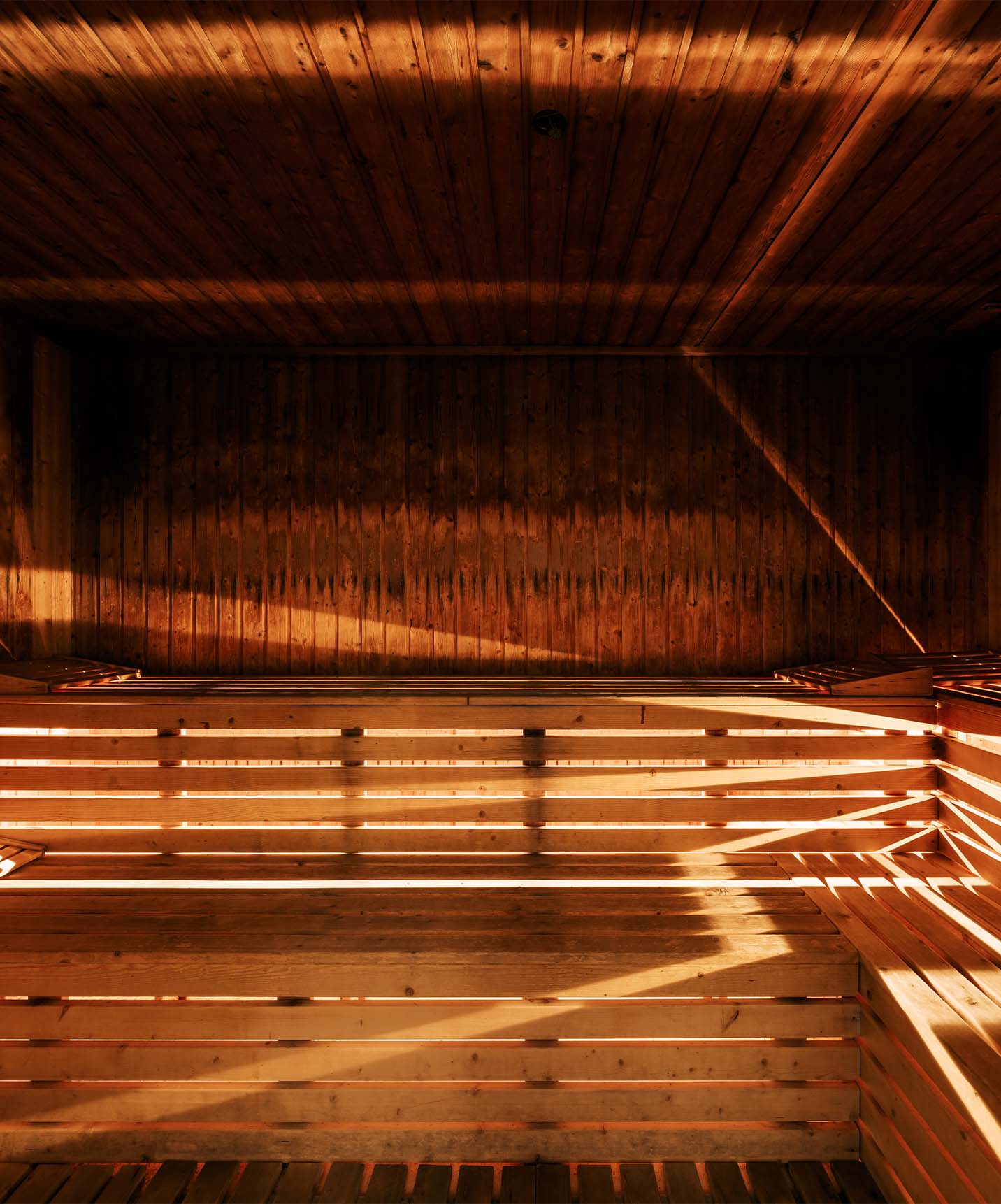 Sauna at Pestana Alvor Praia hotel with two levels and wooden slatted cushions for relaxation