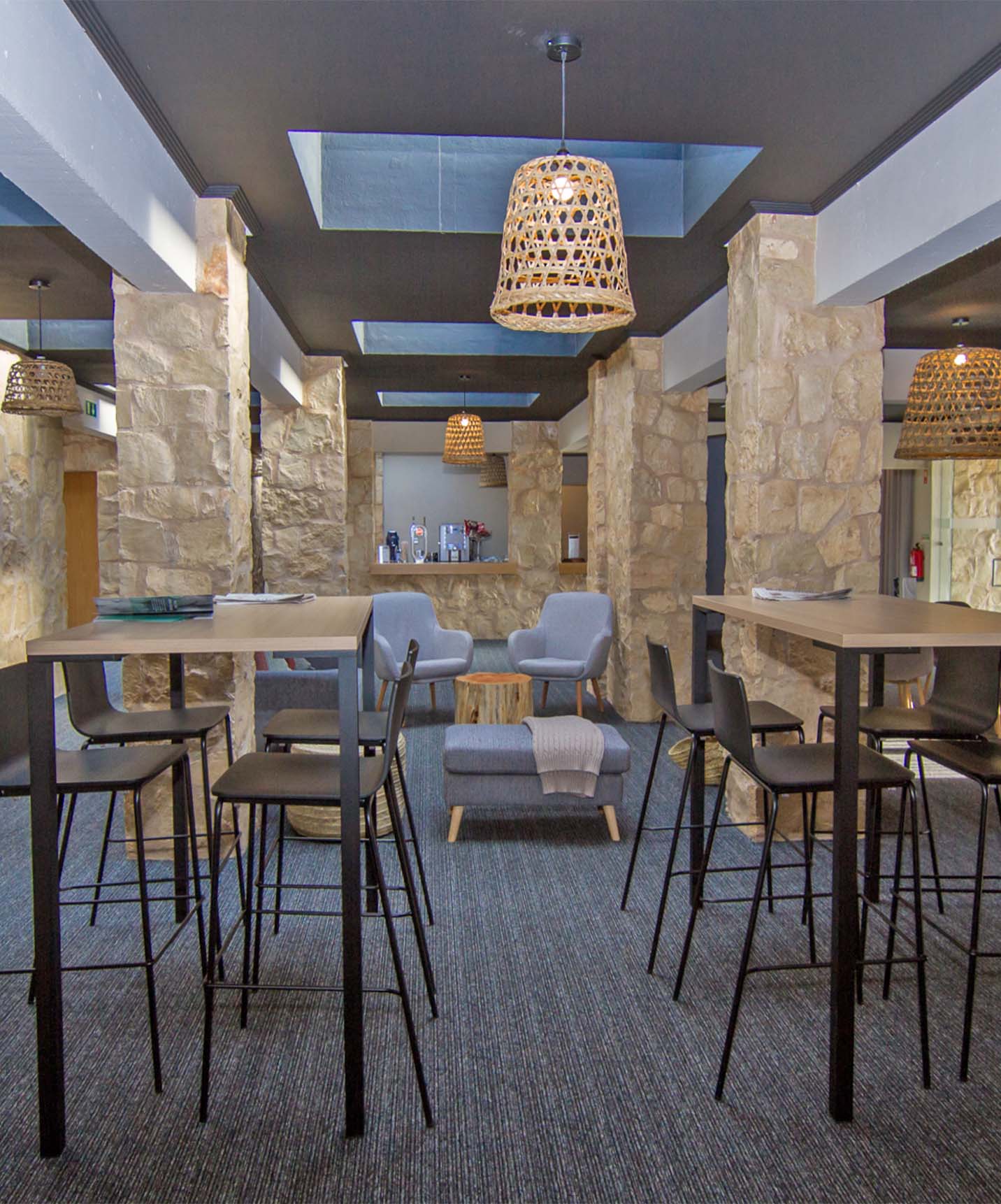 Restaurant with several tables and modern decor at Pestana Carvoeiro hotel near golf courses