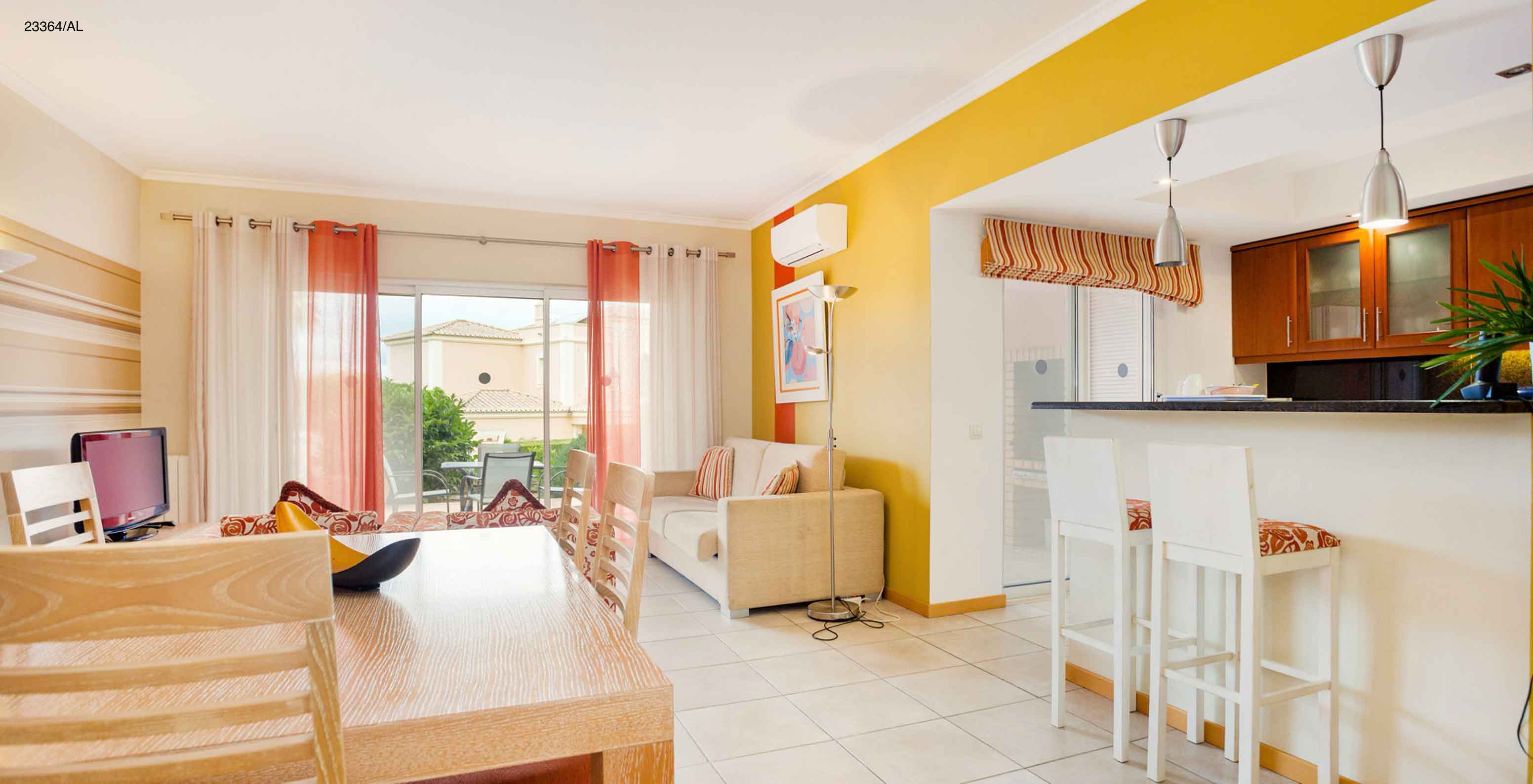 The Pestana Carvoeiro Golf T1 Standard Apartment has an open kitchen to the dining and living room