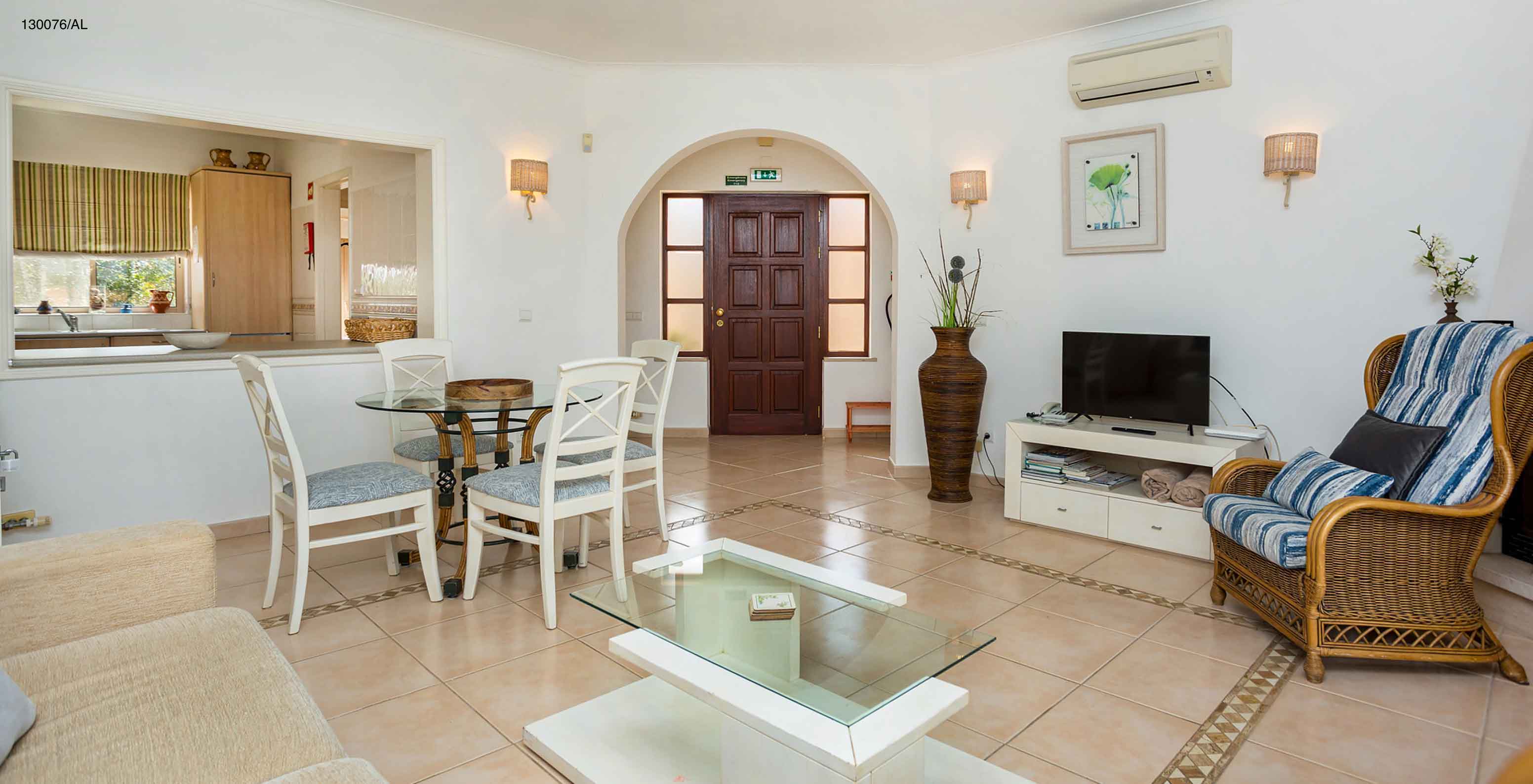 The Pestana Carvoeiro Golf T2 Standard Apartment has a living room with a view to the kitchen