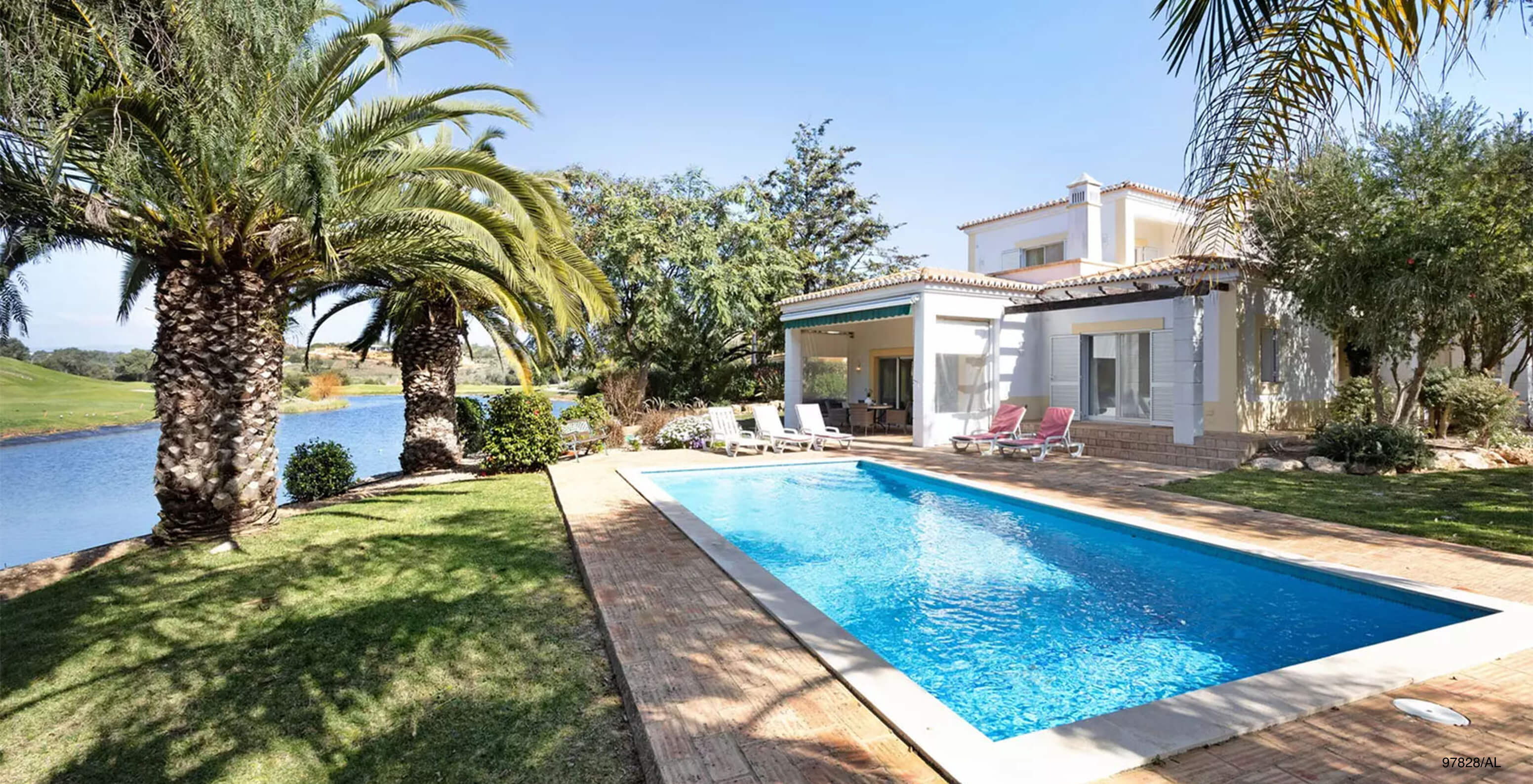 The Pestana Carvoeiro Golf V3 Standard Villa has an exterior patio with grass and a rectangular pool