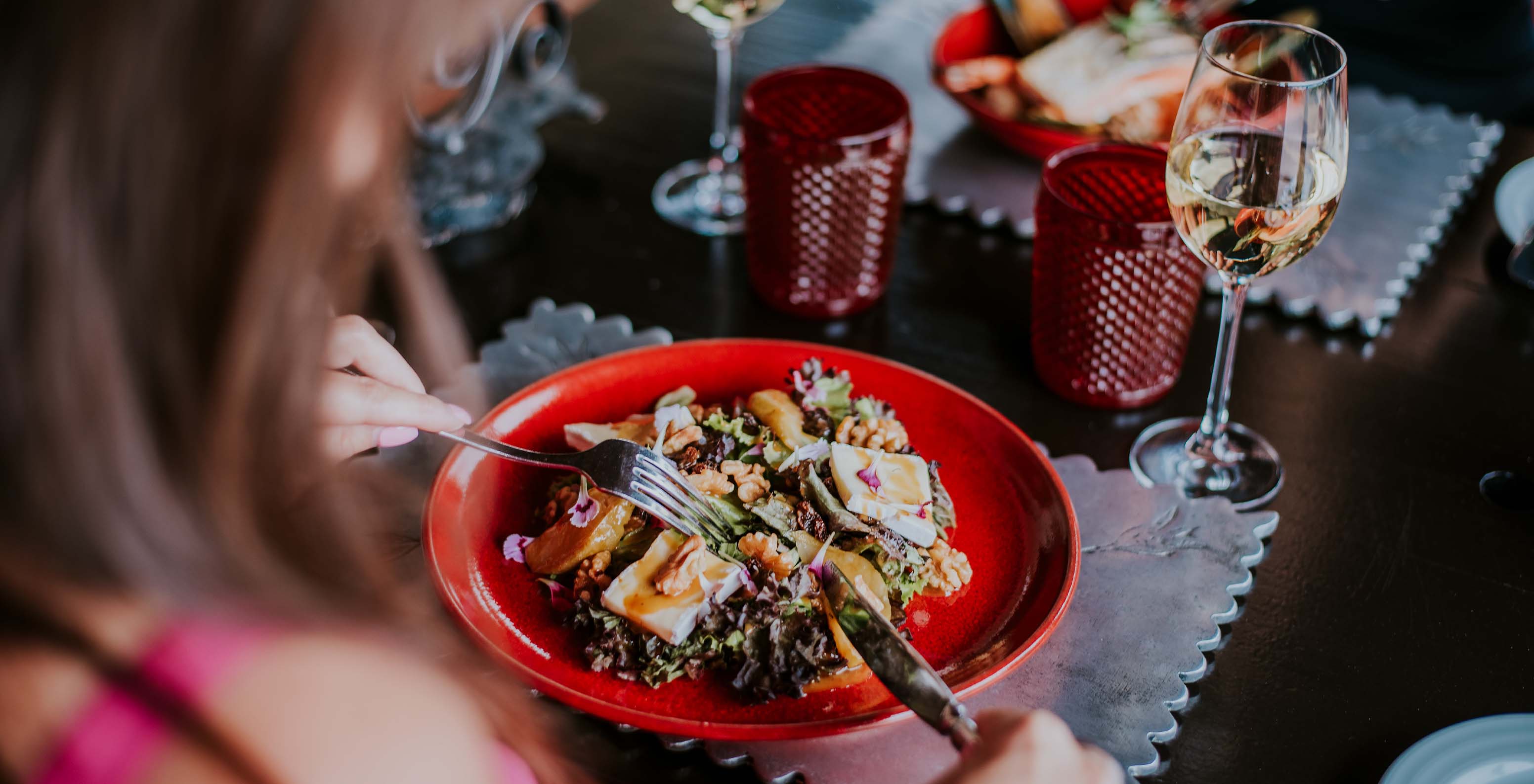 The Clubhouse restaurant at Gramacho serves salads with goat cheese, honey, and nuts