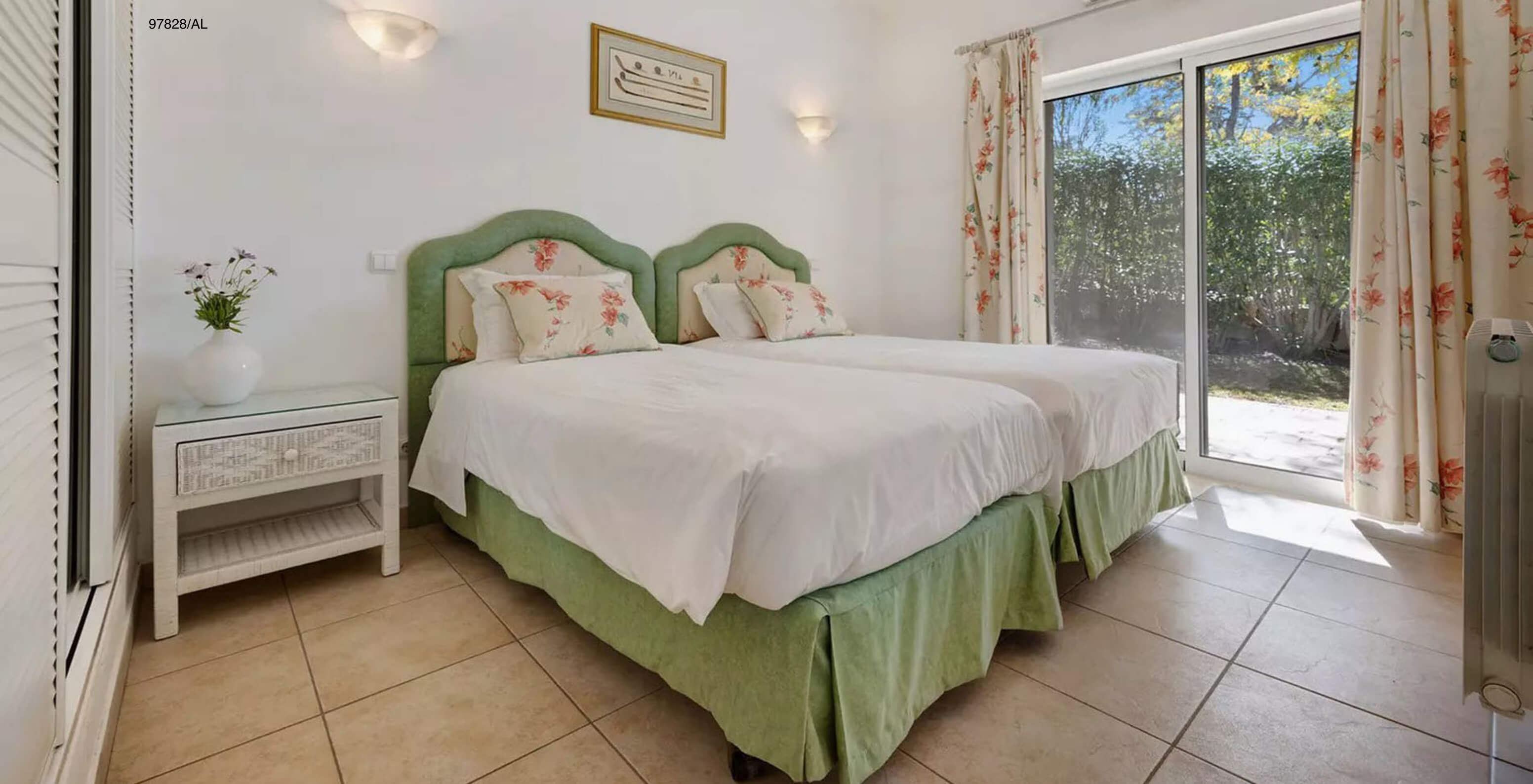 The Pestana Carvoeiro Golf V3 Standard Villa has a bedroom with two single beds, a nightstand, and a balcony