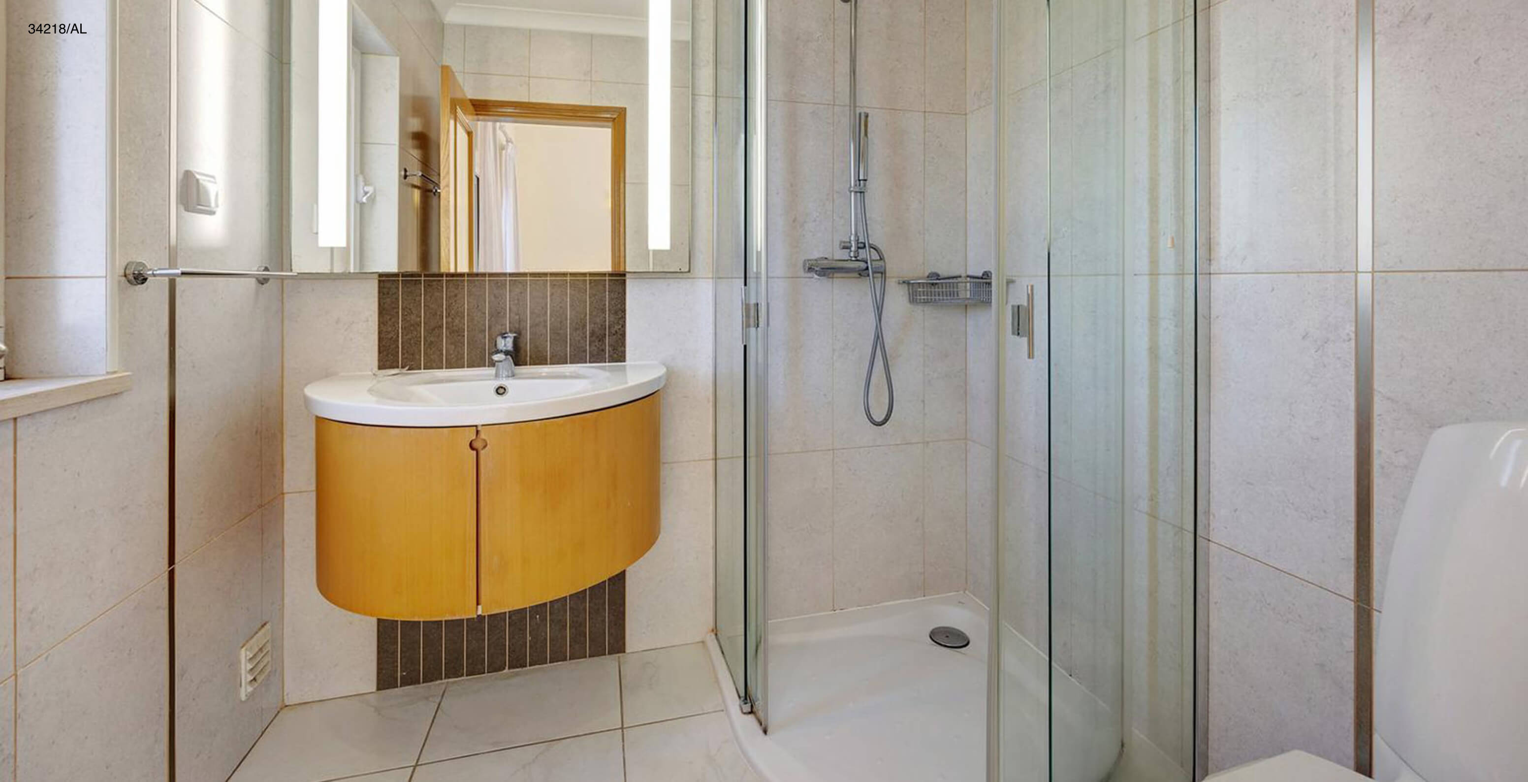 The Pestana Carvoeiro Golf V4 Standard Villa has a bathroom with a sink, mirror, and shower