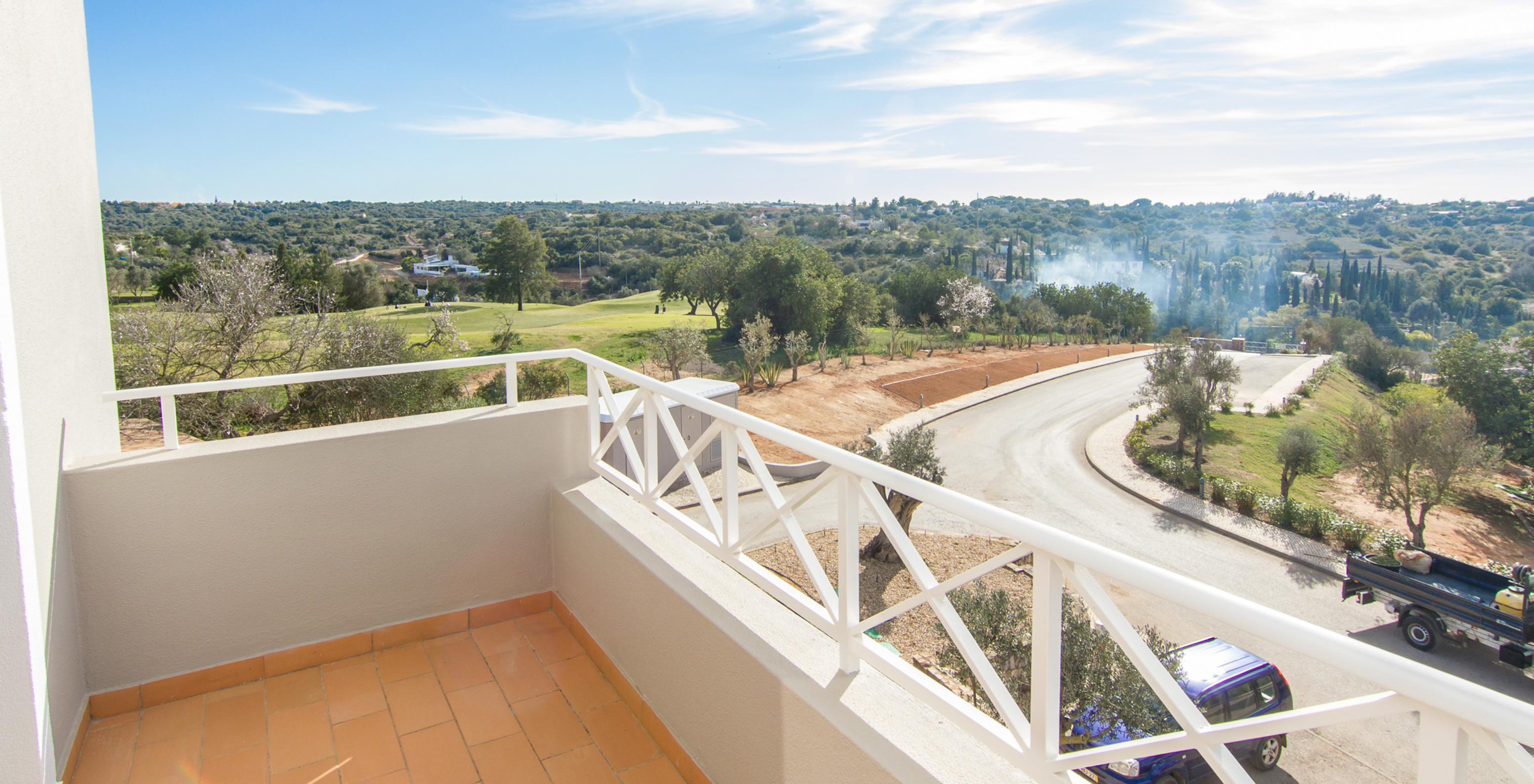 The T1 Apartment at Pestana Gramacho Residences includes a balcony with a view of the road and the golf course