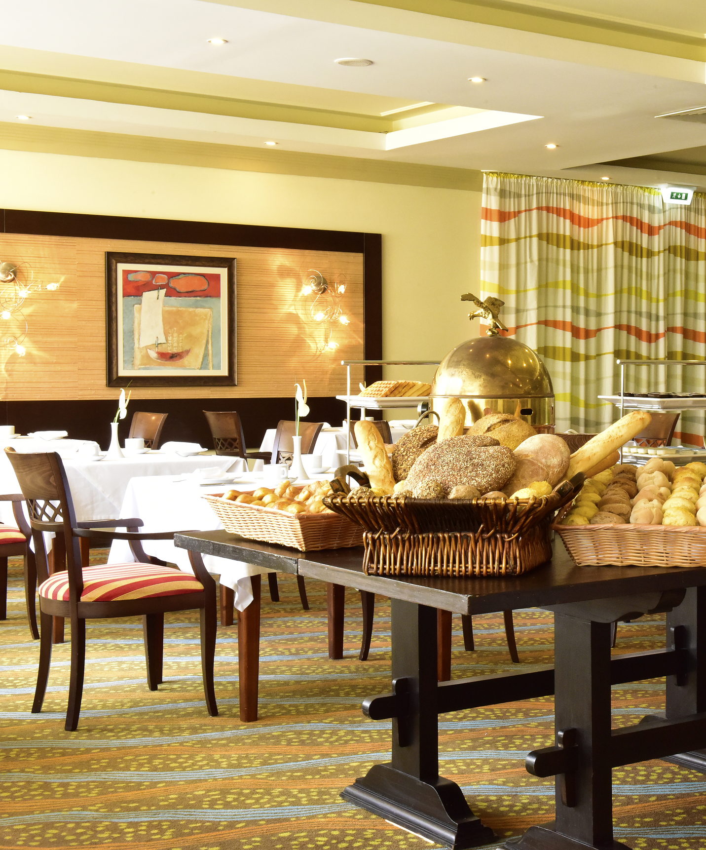 Pestana Viking has a restaurant with various chairs and tables for enjoying a varied meal