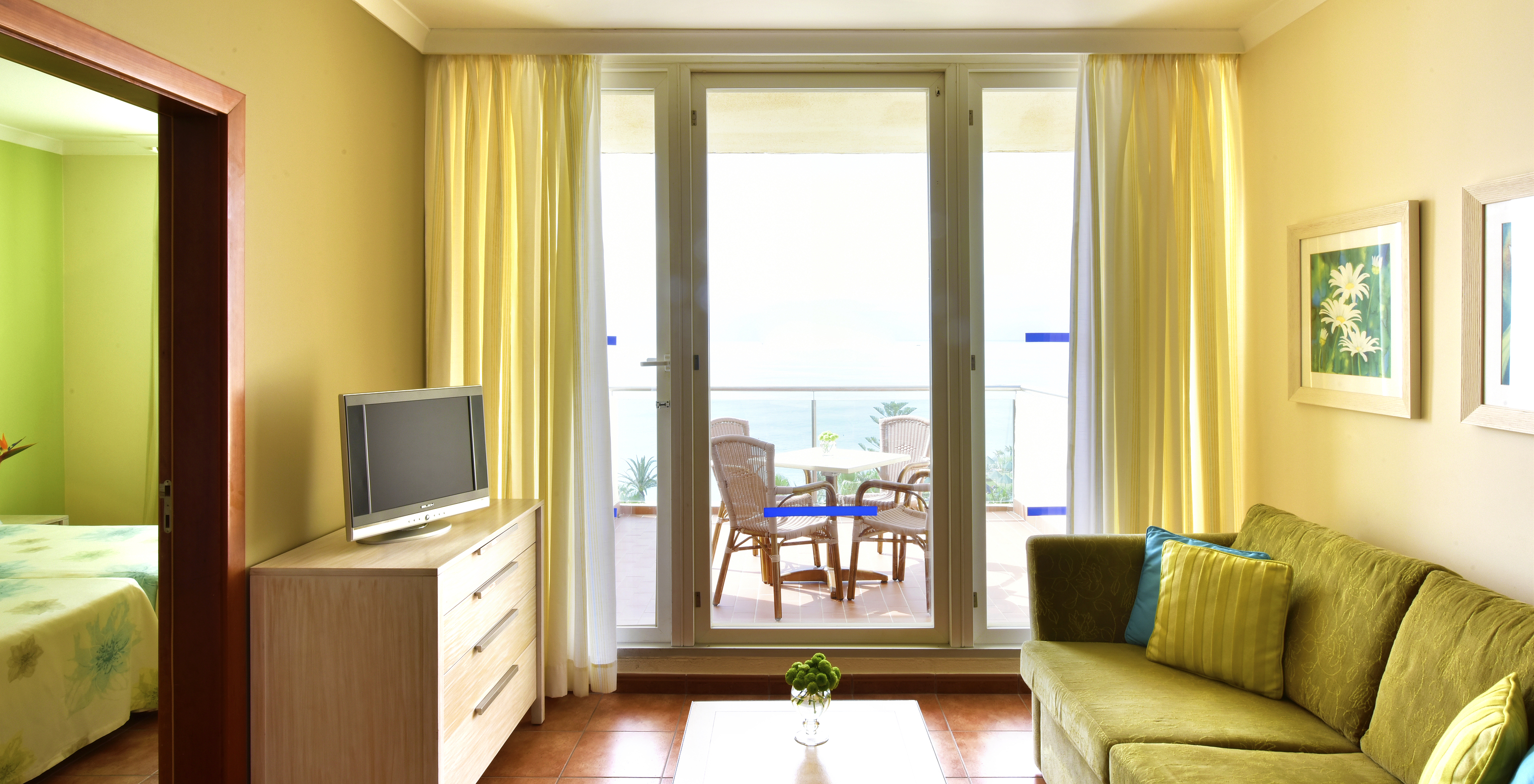 The Sea View Suite at Pestana Viking features television, a sofa with coffee table, and a balcony with sea view