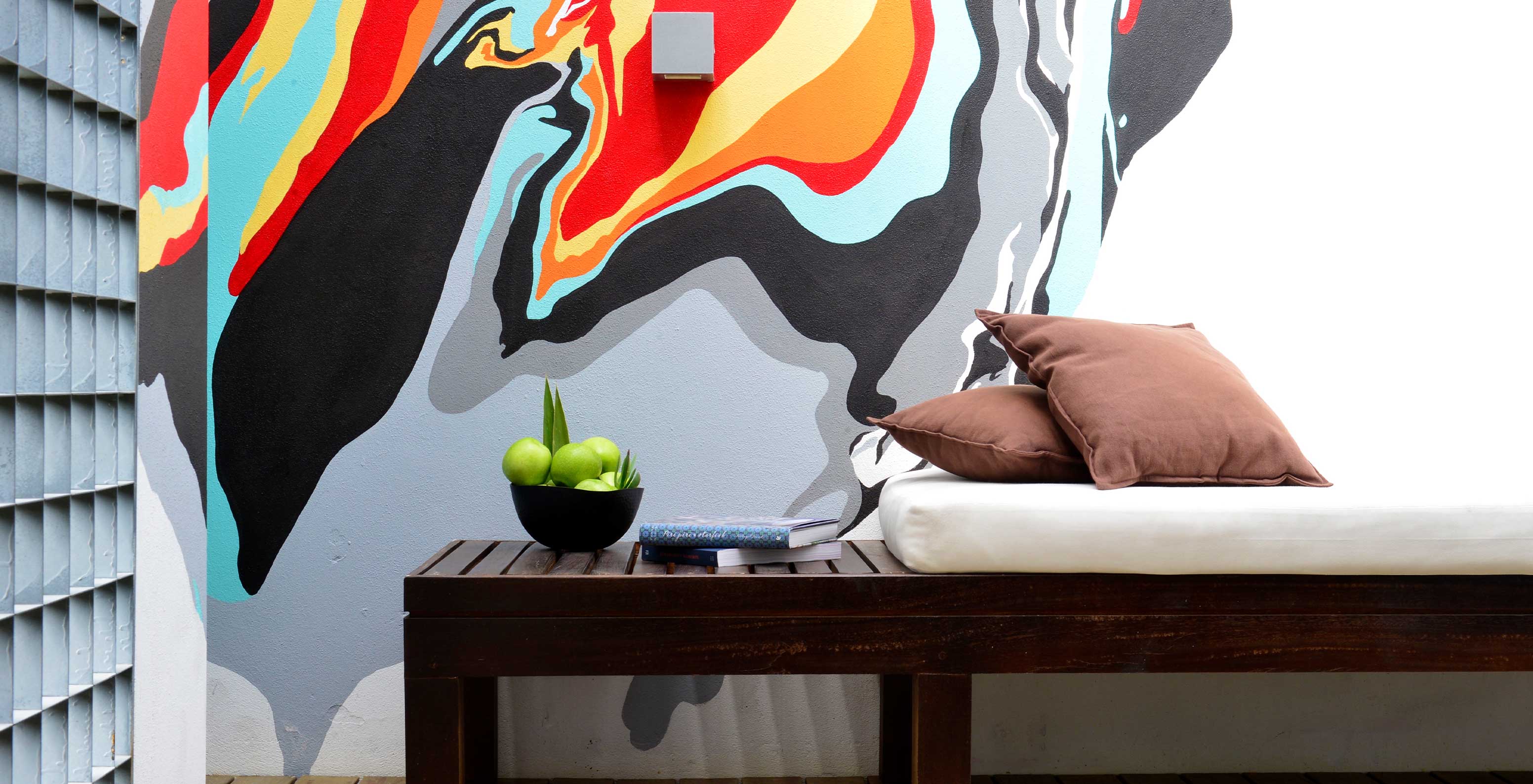 The Superior Room with Balcony at Pestana Cidadela Cascais has a wooden bench on the balcony and art on the wall