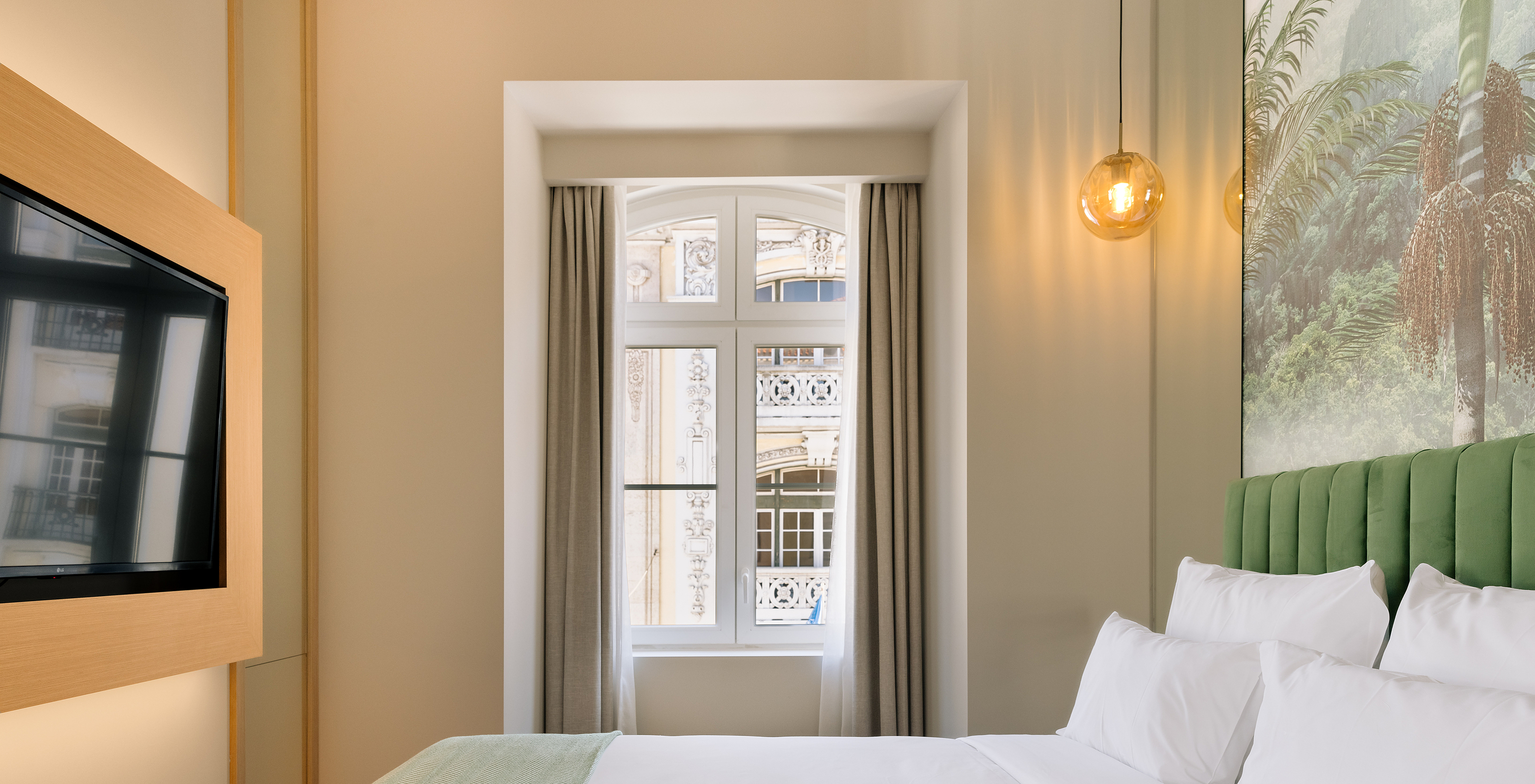 The Superior Room of Pestana Rua Augusta Lisboa has a double bed, television, and a window with city view