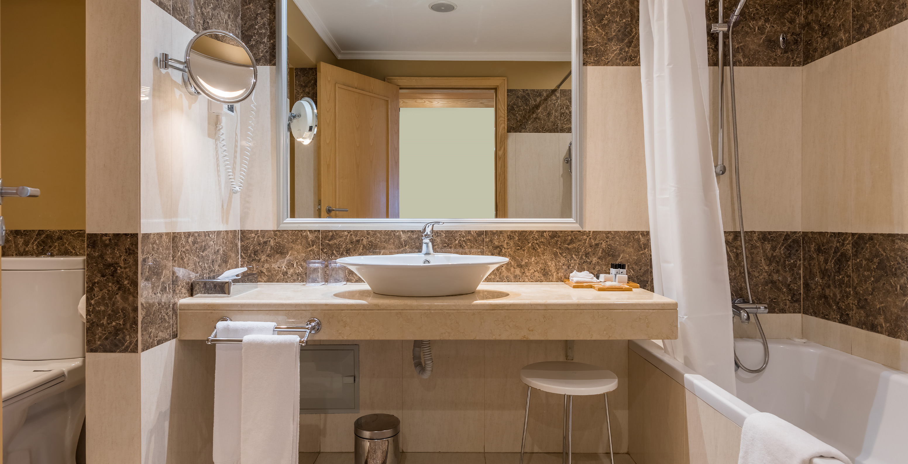 The Classic Double Room with City View at Pestana Carlton Madeira has a tiled bathroom, bathtub, and toilet