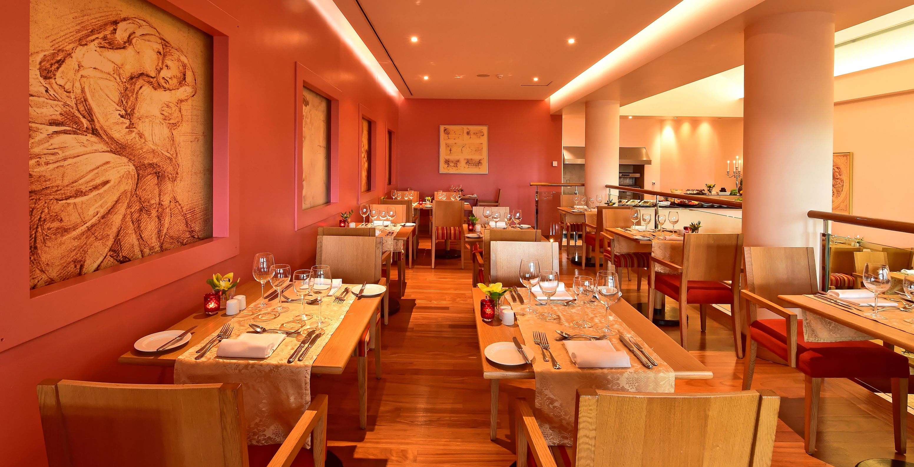 The Trattoria de La Fontana restaurant at the 5-Star Hotel in Funchal, Madeira, has a spacious area with red walls