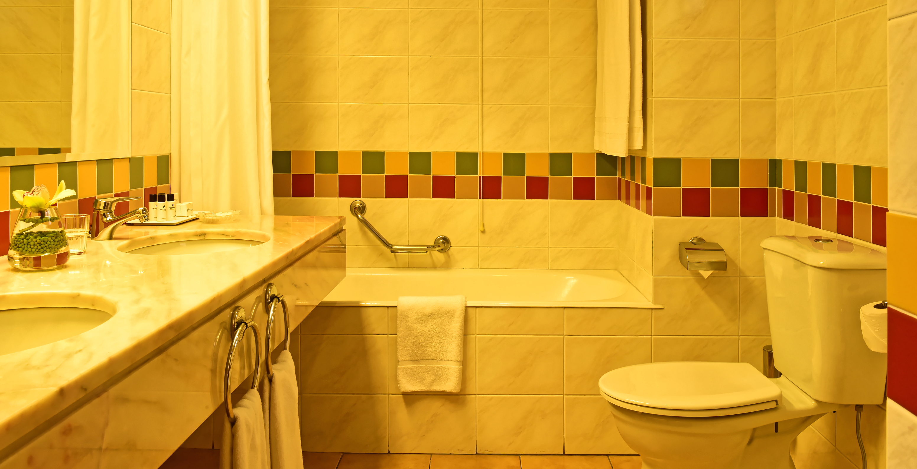 The Superior Studio at Pestana Ocean Bay All Inclusive features a bathroom with square tiles and a bathtub