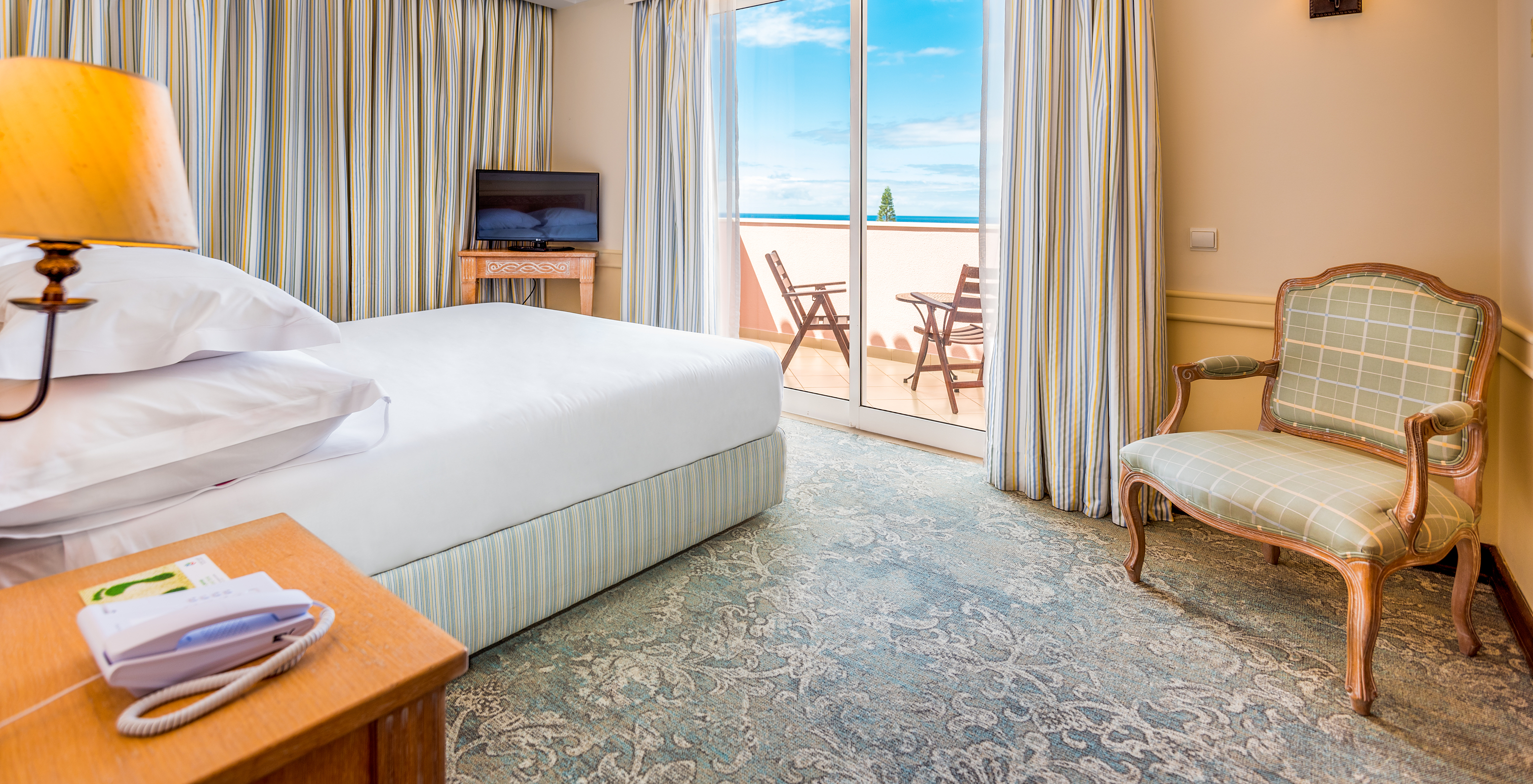 The Deluxe Room with Balcony of Pestana Royal All Inclusive has a double bed with television and a balcony with view