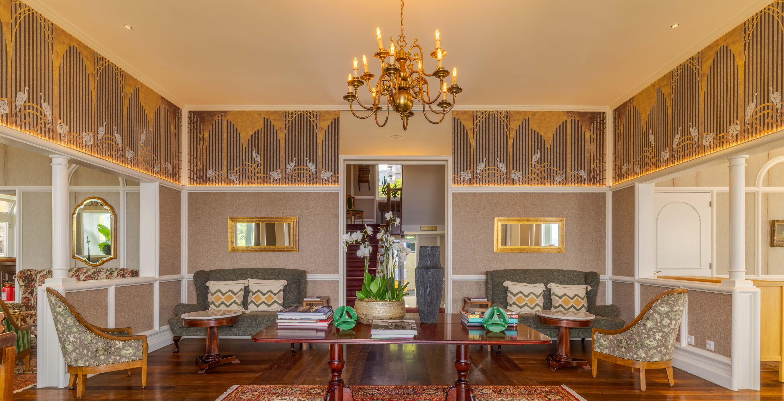 Pestana Vila Lido Madeira has a house with a living room featuring chairs, sofas and art