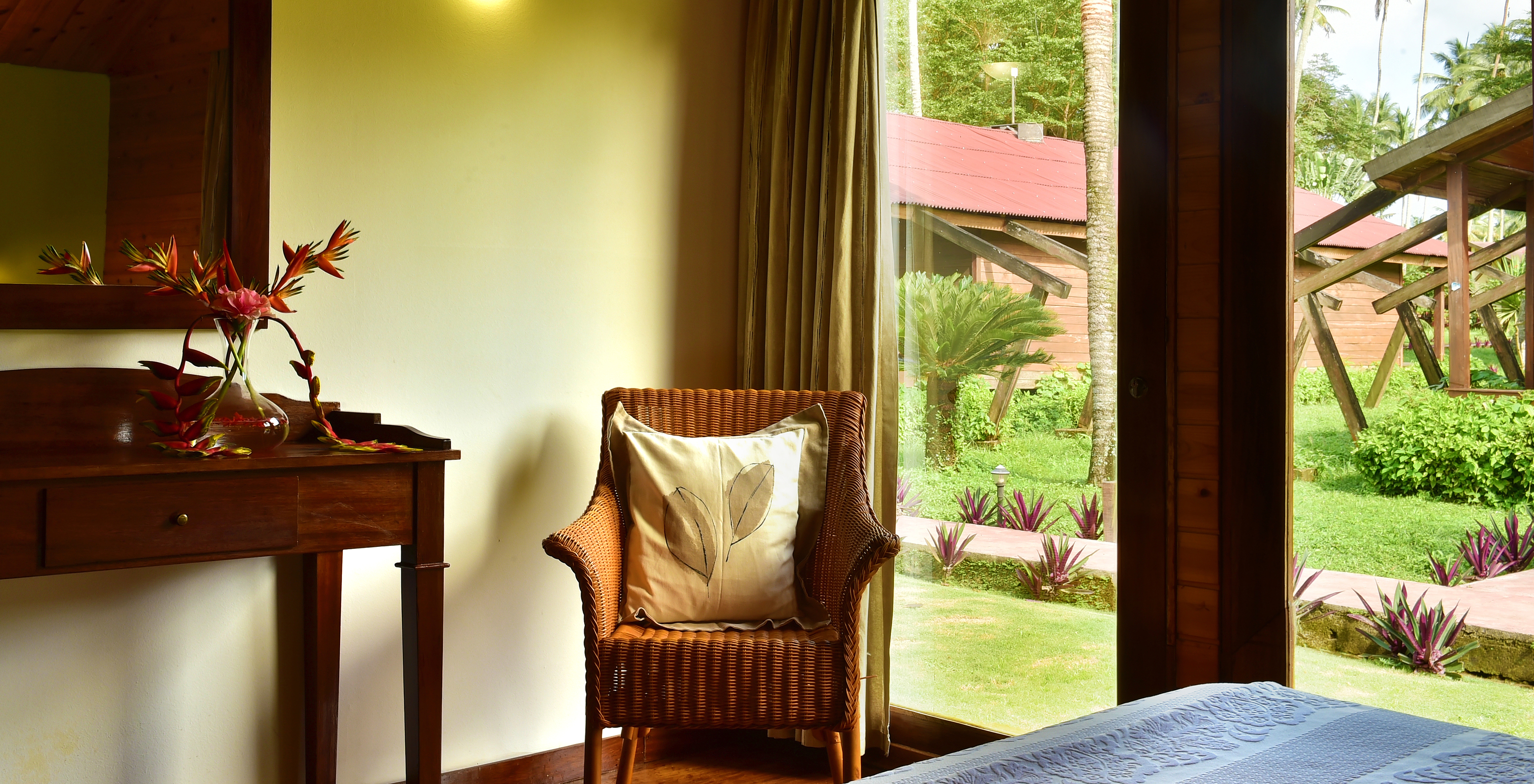 The Standard Double at Pestana Equador Ilheu das Rolas includes a chair and a window with a garden view