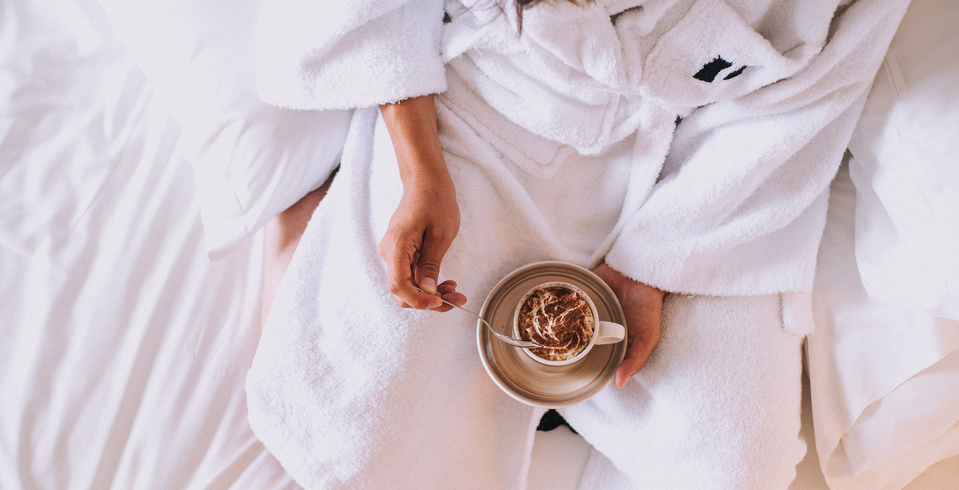 The Superior room at Pestana Miramar São Tomé includes a white bathrobe and room service with coffee