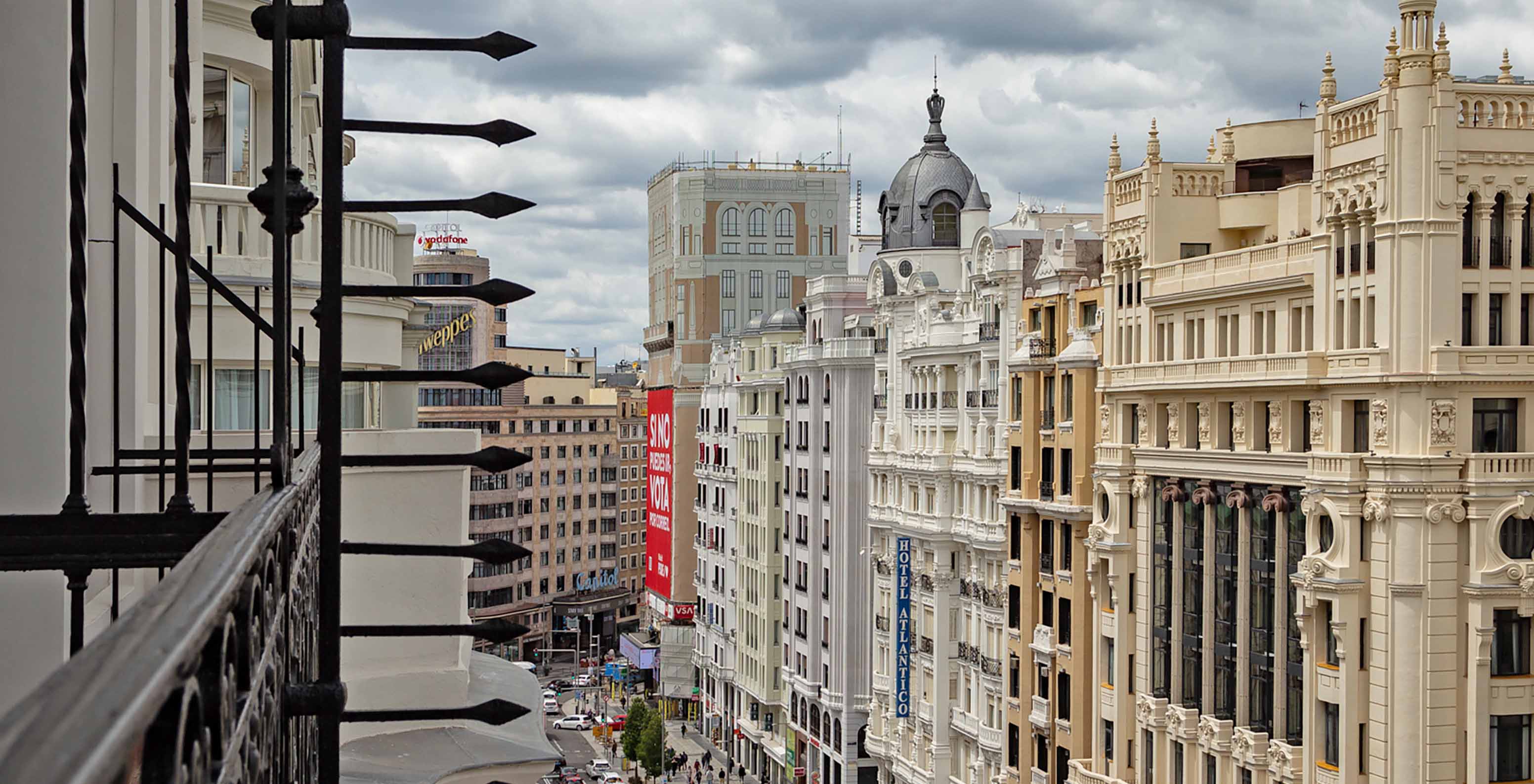 The Deluxe Grand Room with View at Pestana CR7 Gran Vía Madrid has a balcony with views of Gran Vía and nearby buildings