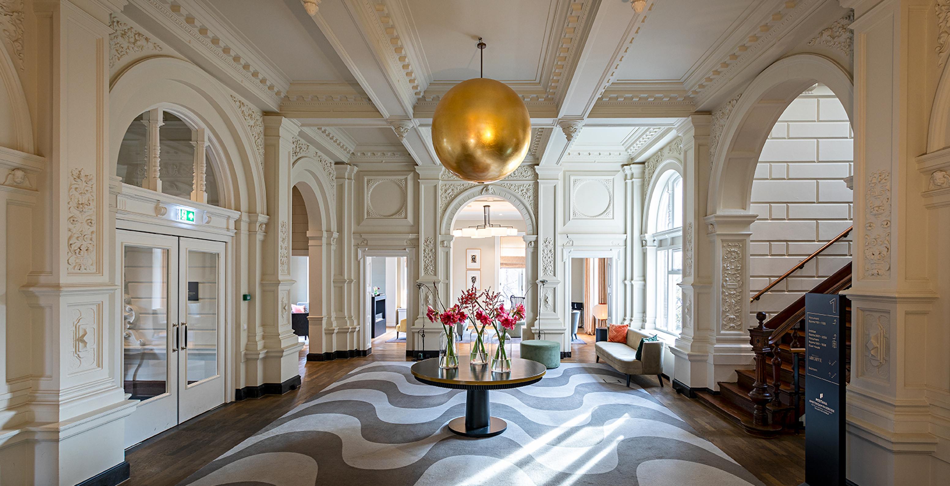 The Pestana Amsterdam Riverside has an entrance hall with a center table with flowers