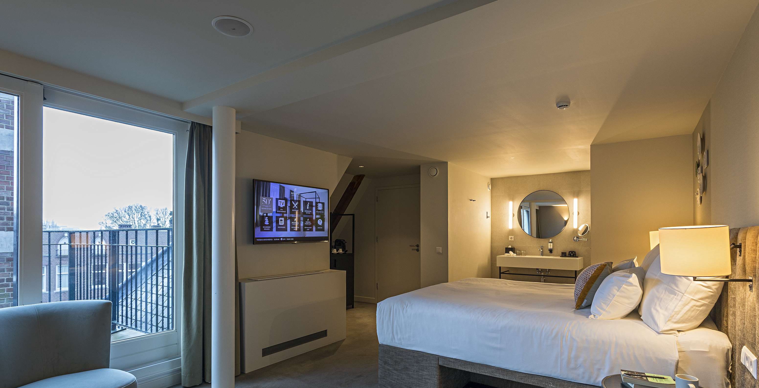 Executive Terrace at Pestana Amsterdam Riverside has a double bed and bedside table