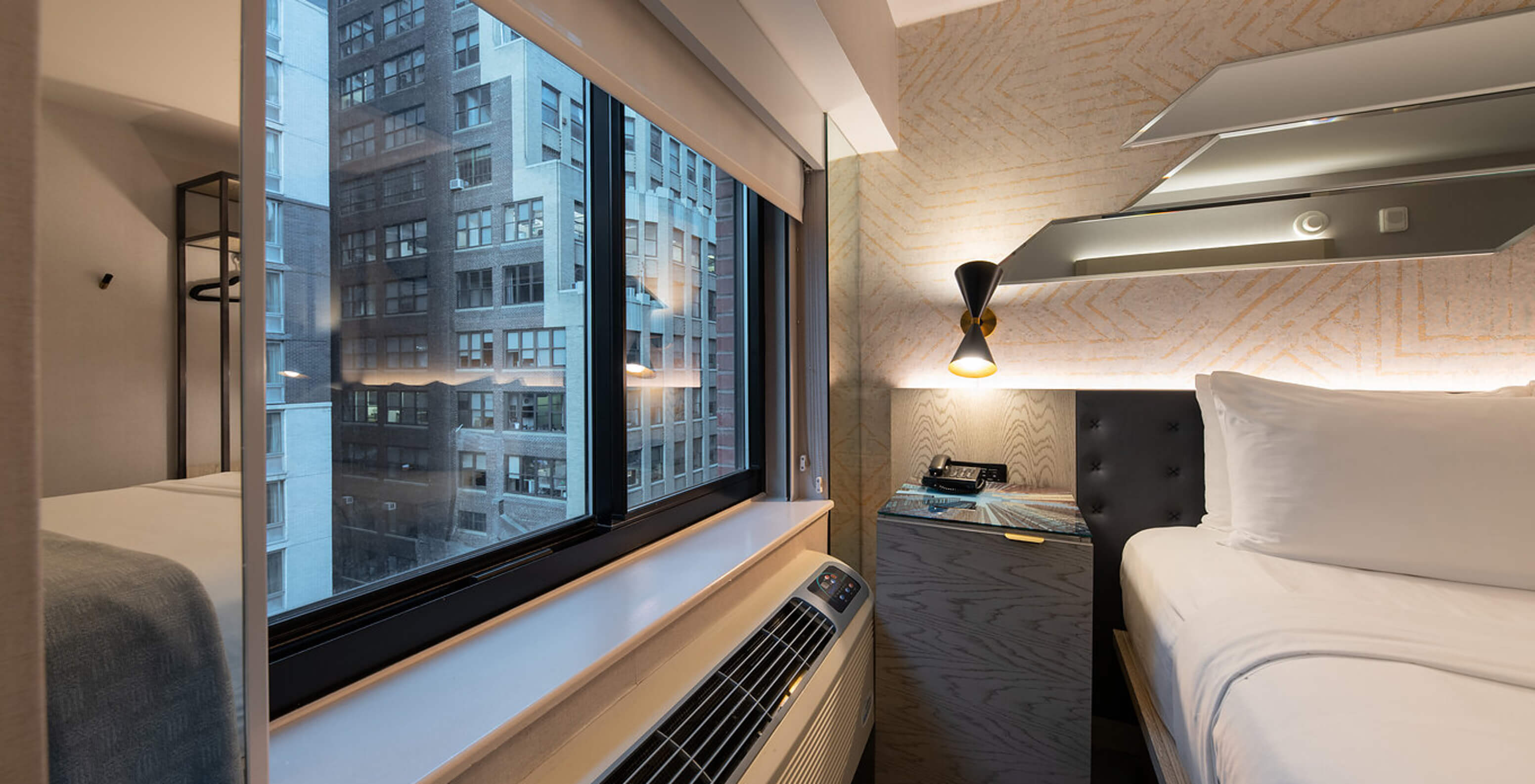 The Comfort Street View at Pestana CR7 Times Square has a city view window next to the double bed