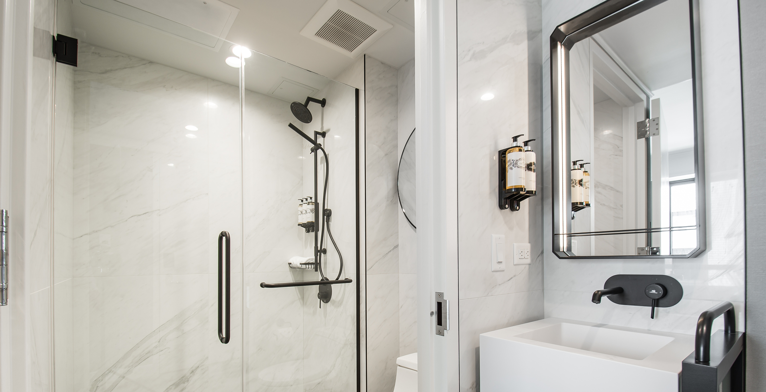 The Classic room at Pestana Park Avenue has a bathroom with shower, sink, mirror and toilet