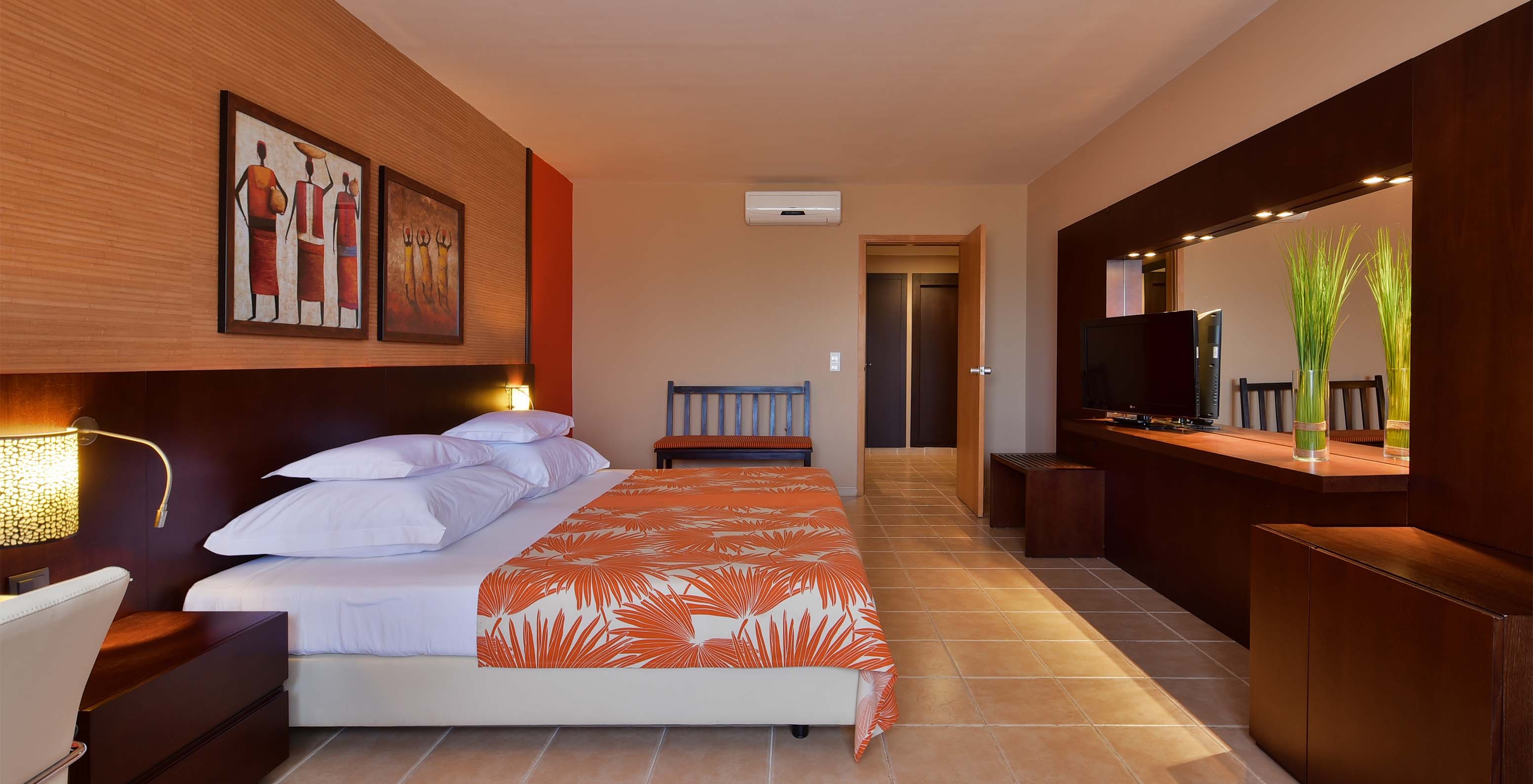 The Classic Sea View room at Pestana Tropico features a double bed, television, bedside table, mirror, and air conditioning