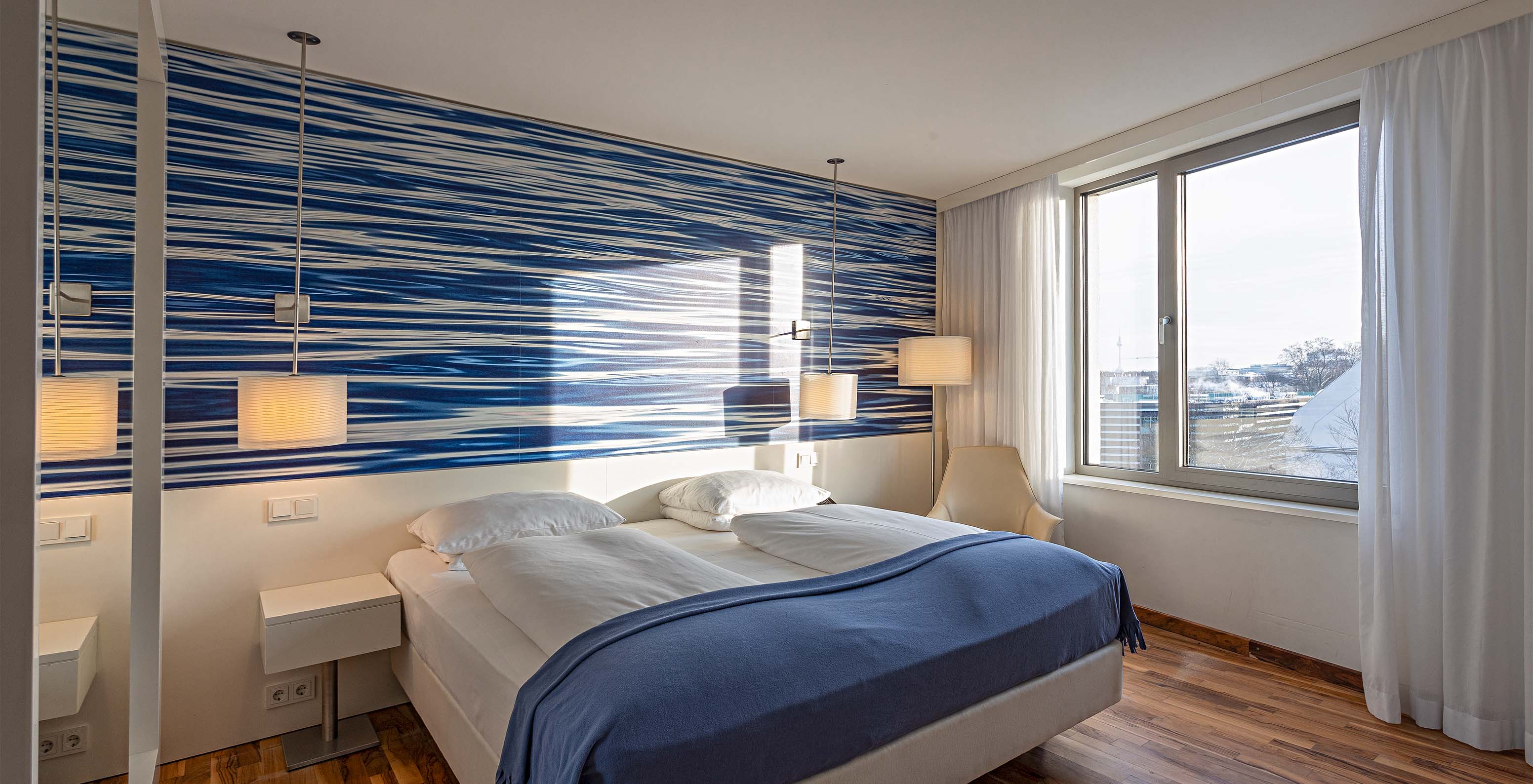 Deluxe High Floor room at Pestana Berlin Tiergarten has a double bed and a window with city view