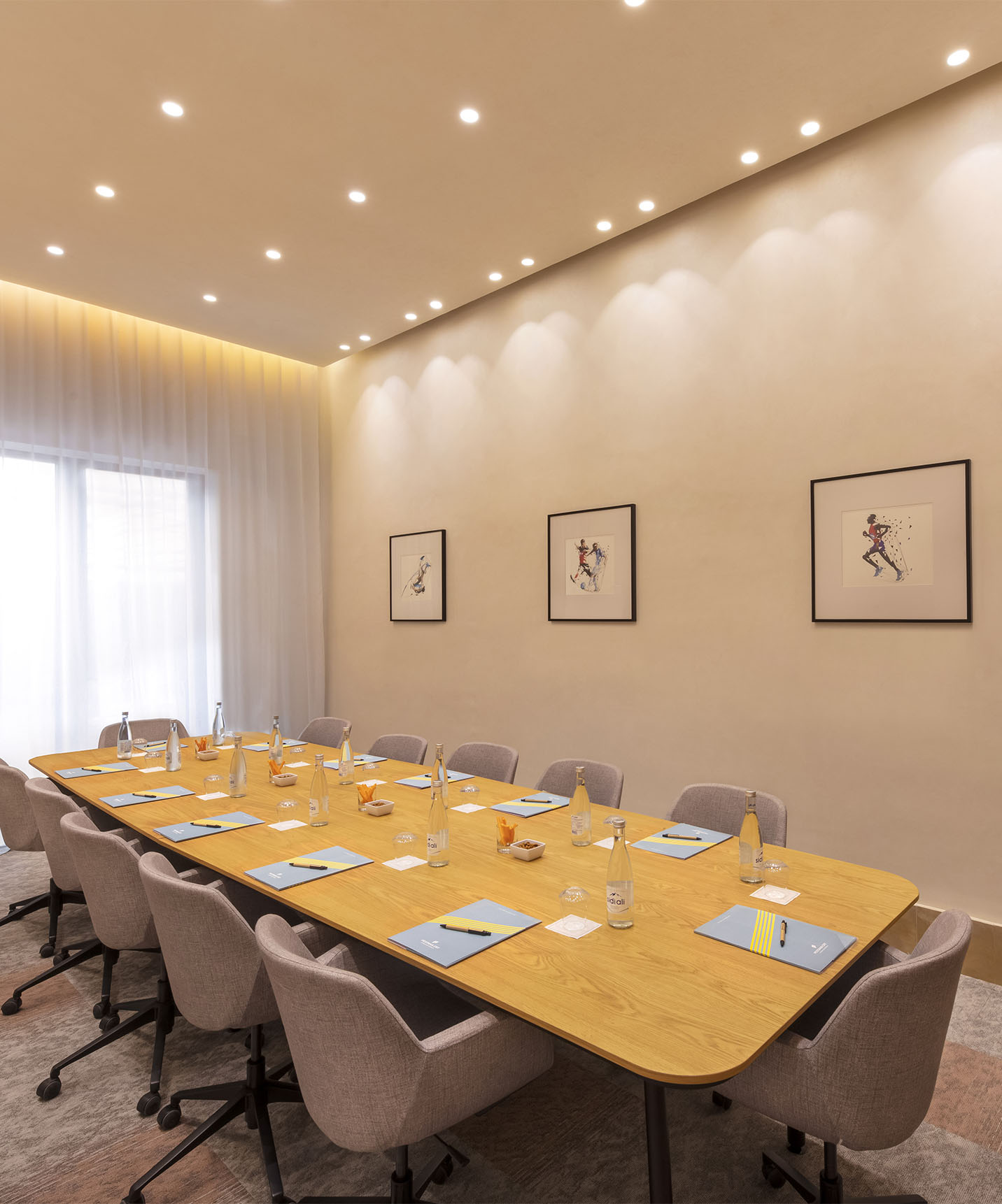 Meeting and conference room with a table and chairs seating several people at Lifestyle Hotel in Morocco with pool