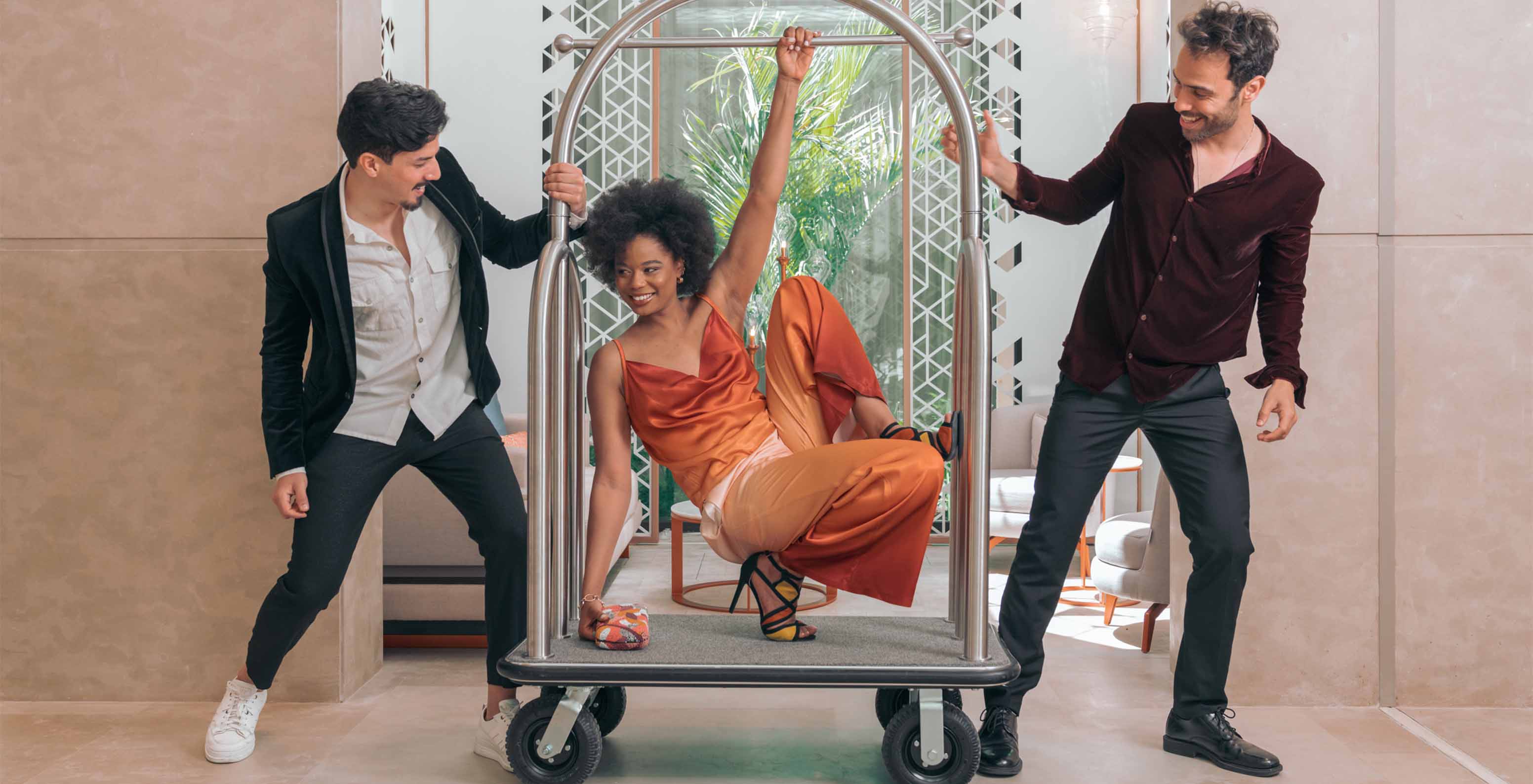 Fun people in the lobby with modern decor and natural lighting at Lifestyle Hotel in Morocco with pool