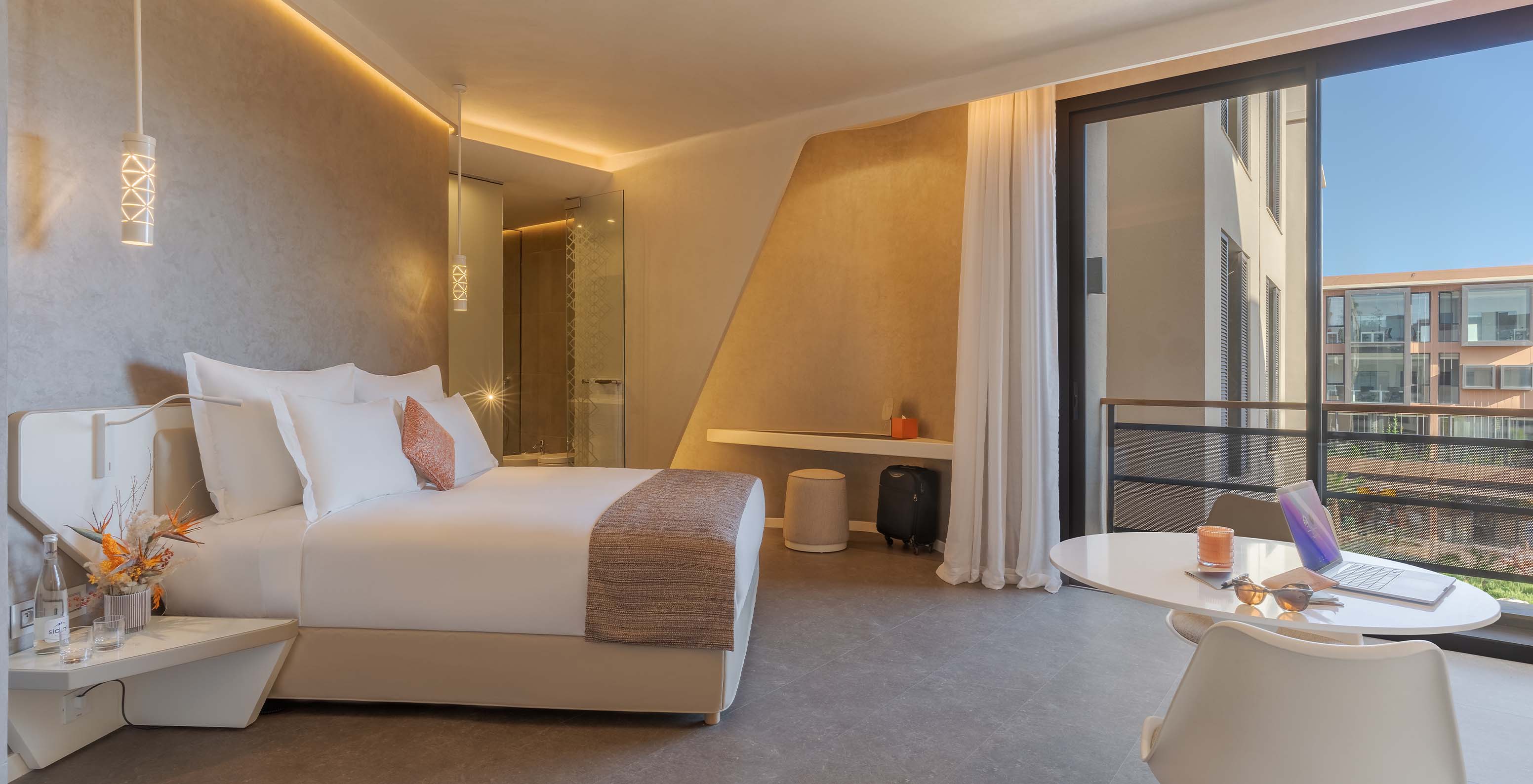 The CR7 Room Avenue at Pestana CR7 Marrakech has a double bed, a table, and a large window with a view of M Avenue