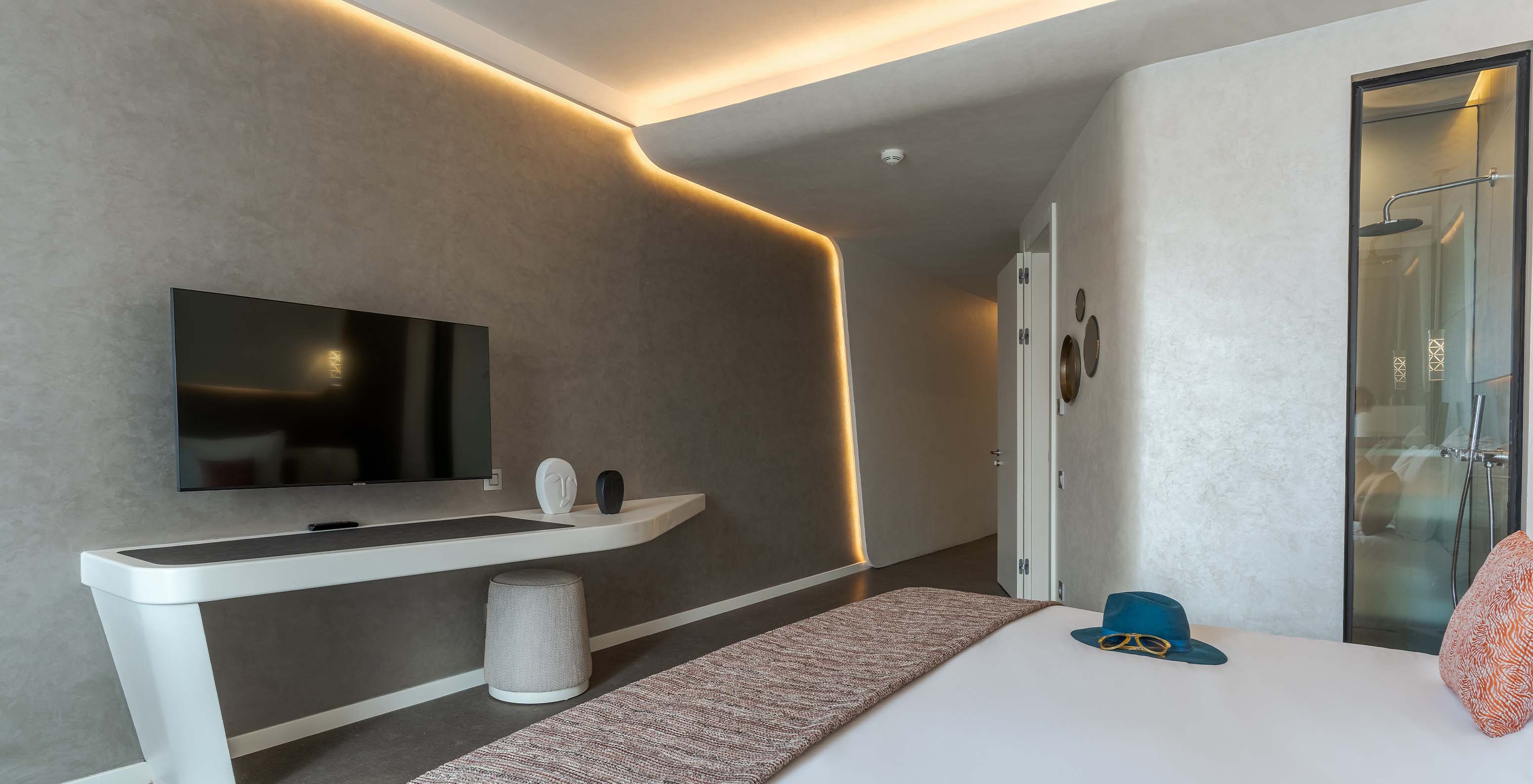 The CR7 Room at Pestana CR7 Marrakech has a TV, a modern desk, and lights illuminating the wall corners