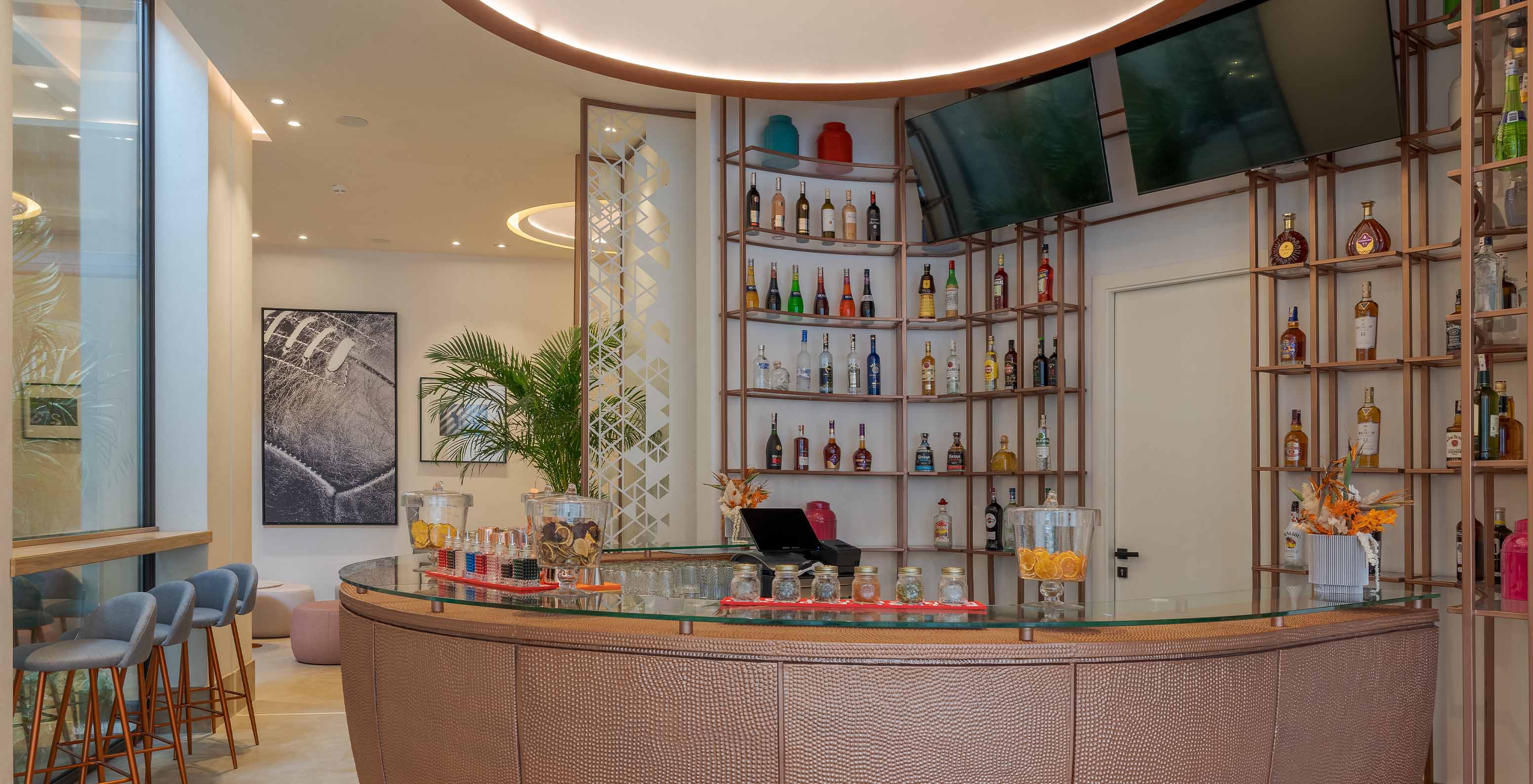 The Sports Bar at the hotel in central Marrakech offers various cocktail and juice options with modern decor