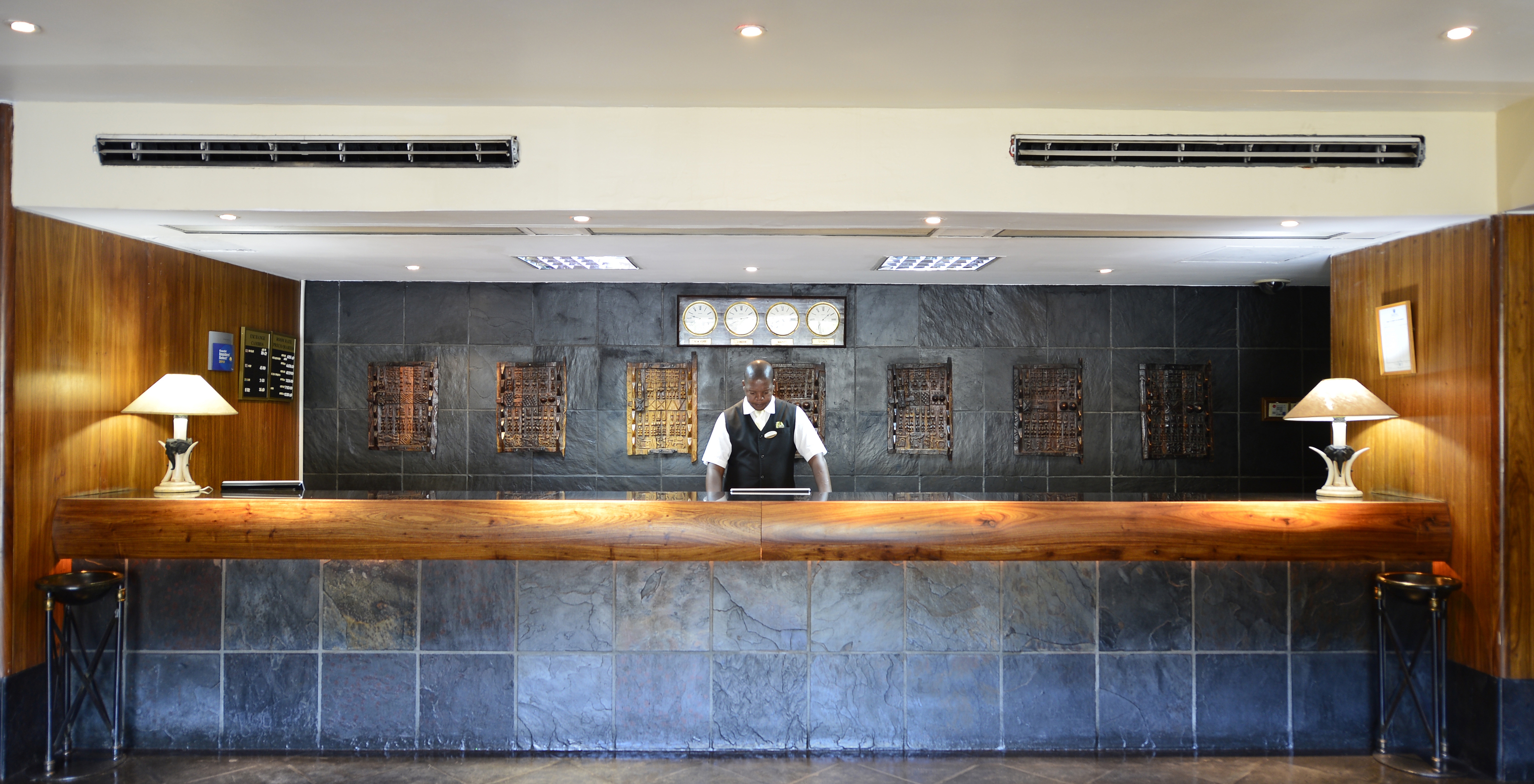 Reception of a hotel in central Maputo, with a staff member ready to assist guests