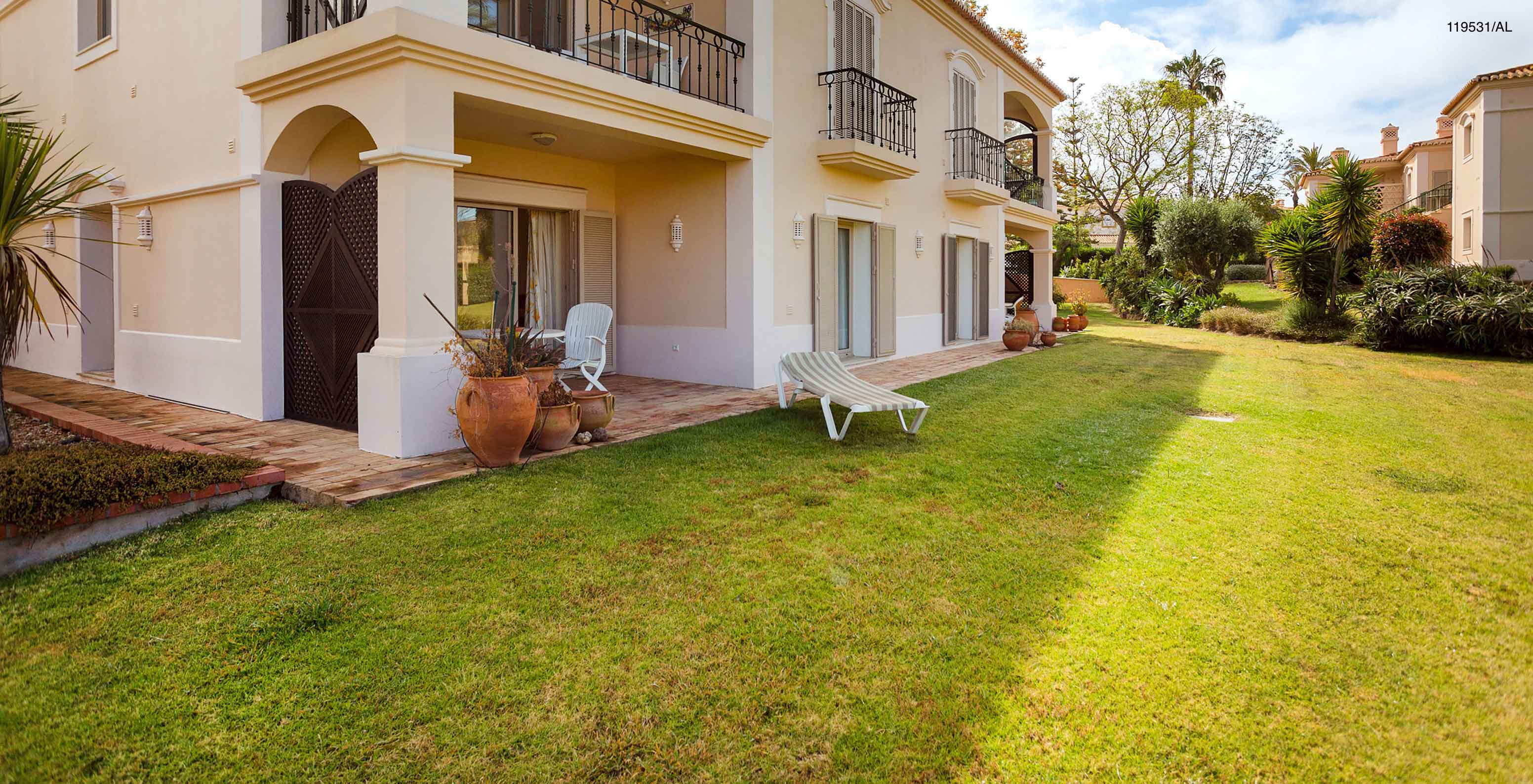 The Pestana Carvoeiro Golf T1 Standard Apartment has an exterior patio with a balcony and grass