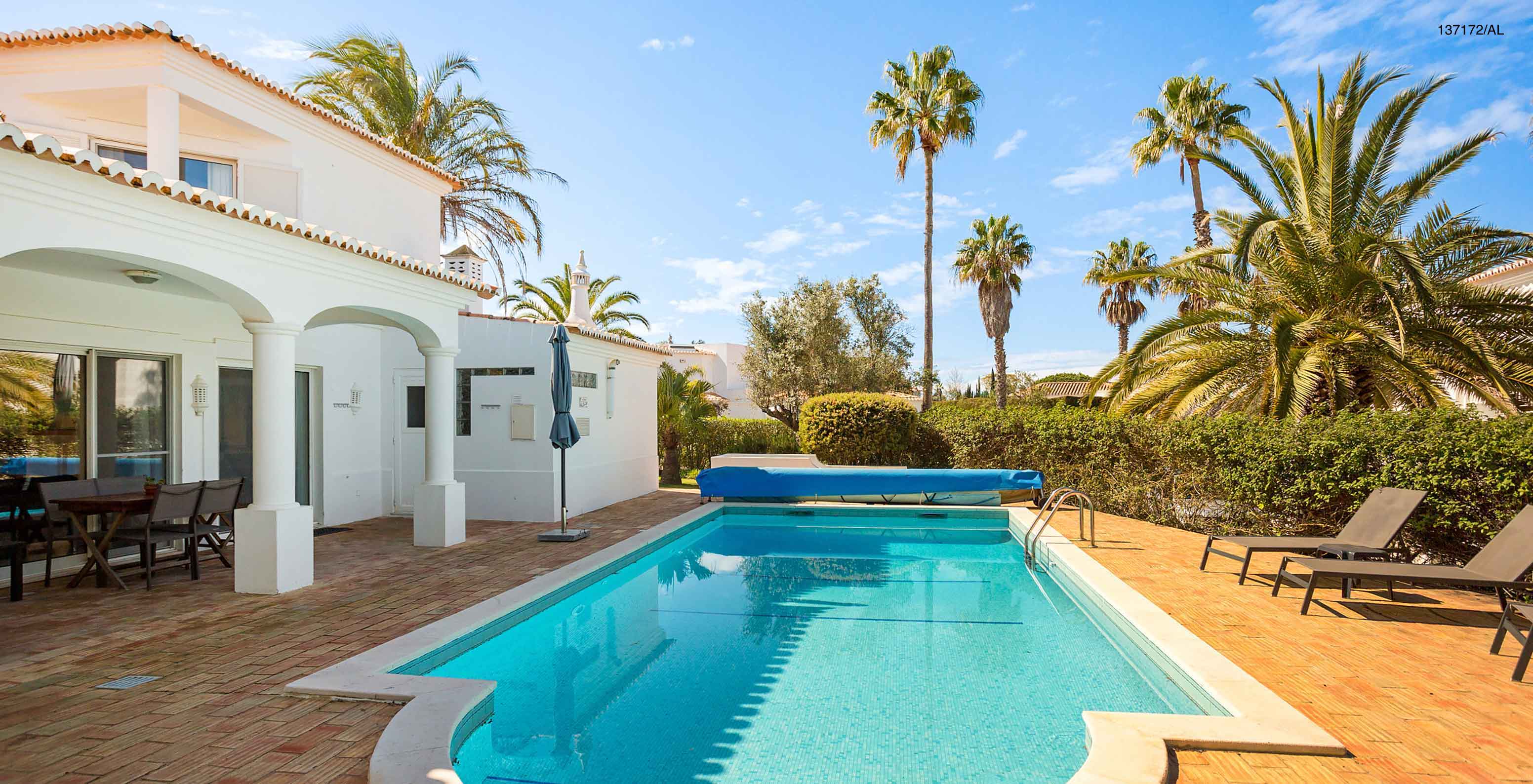 The Pestana Carvoeiro Golf V3 Standard Villa has an exterior patio with a pool and loungers