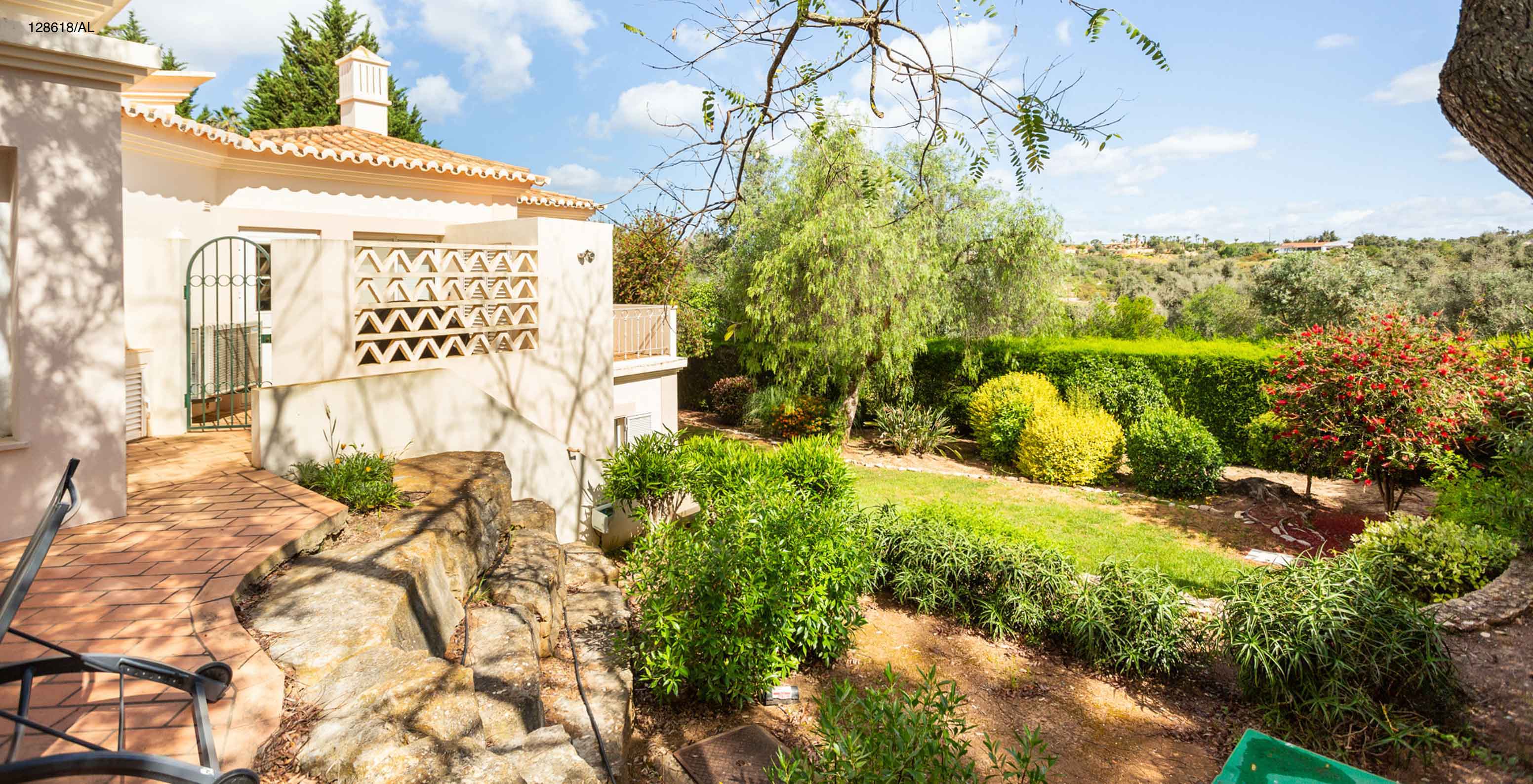 The Pestana Carvoeiro Golf V3 Superior Villa has an exterior patio with grass and trees around it