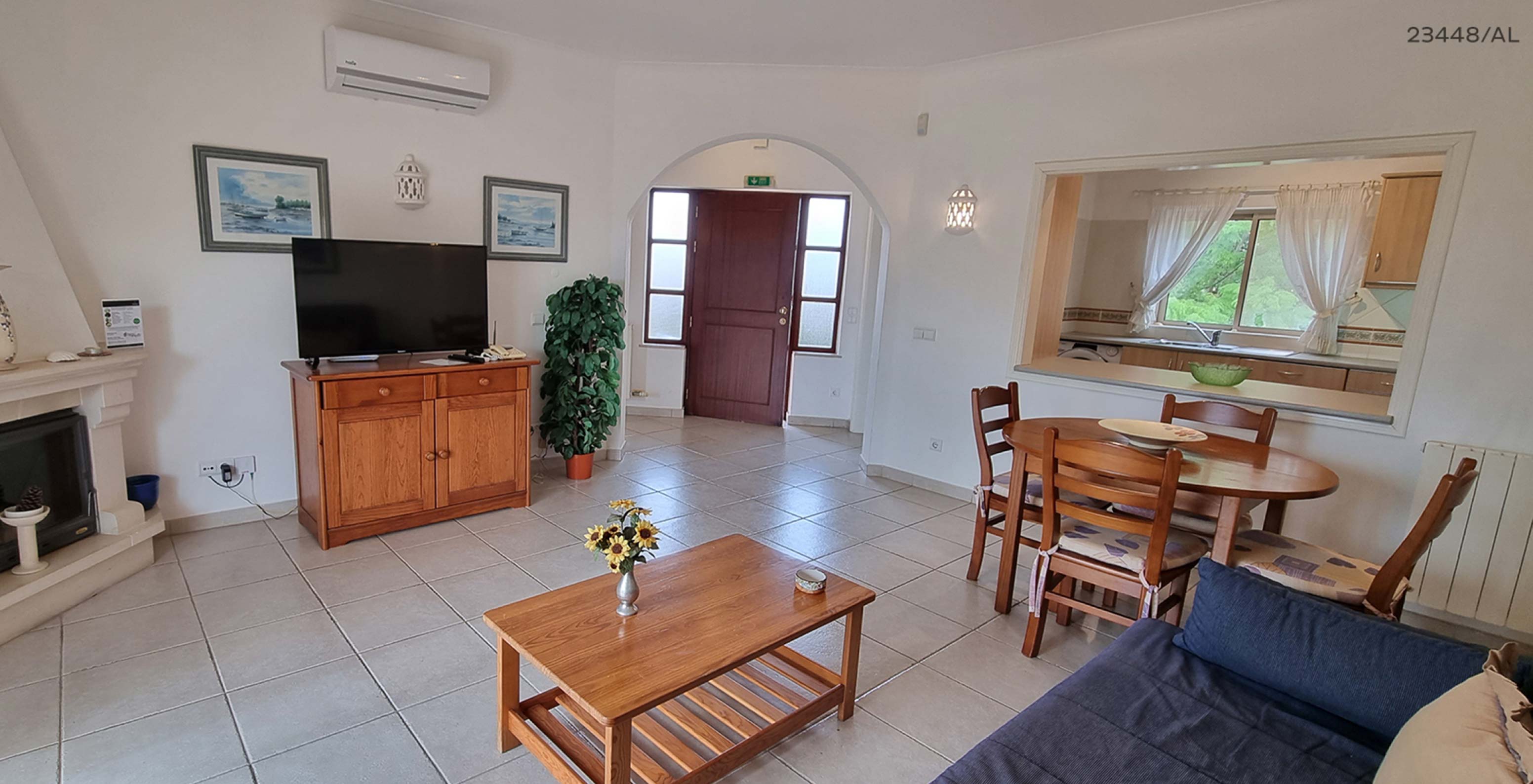 The Pestana Carvoeiro Golf T1 Standard Apartment has a living room with a sofa, tables, chairs, and TV