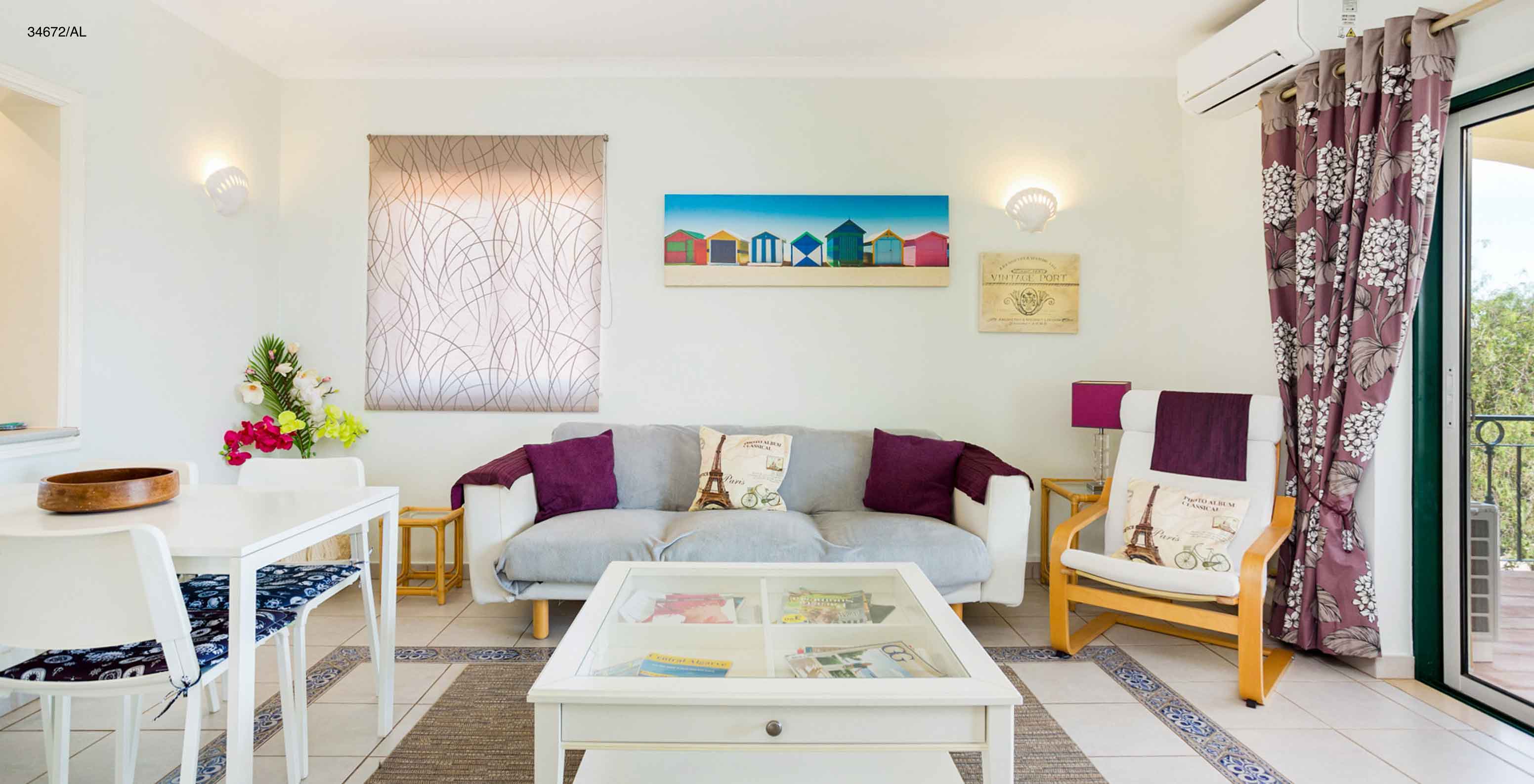 The Pestana Carvoeiro Golf T2 Superior Apartment has a living room with a sofa, dining table, and chairs