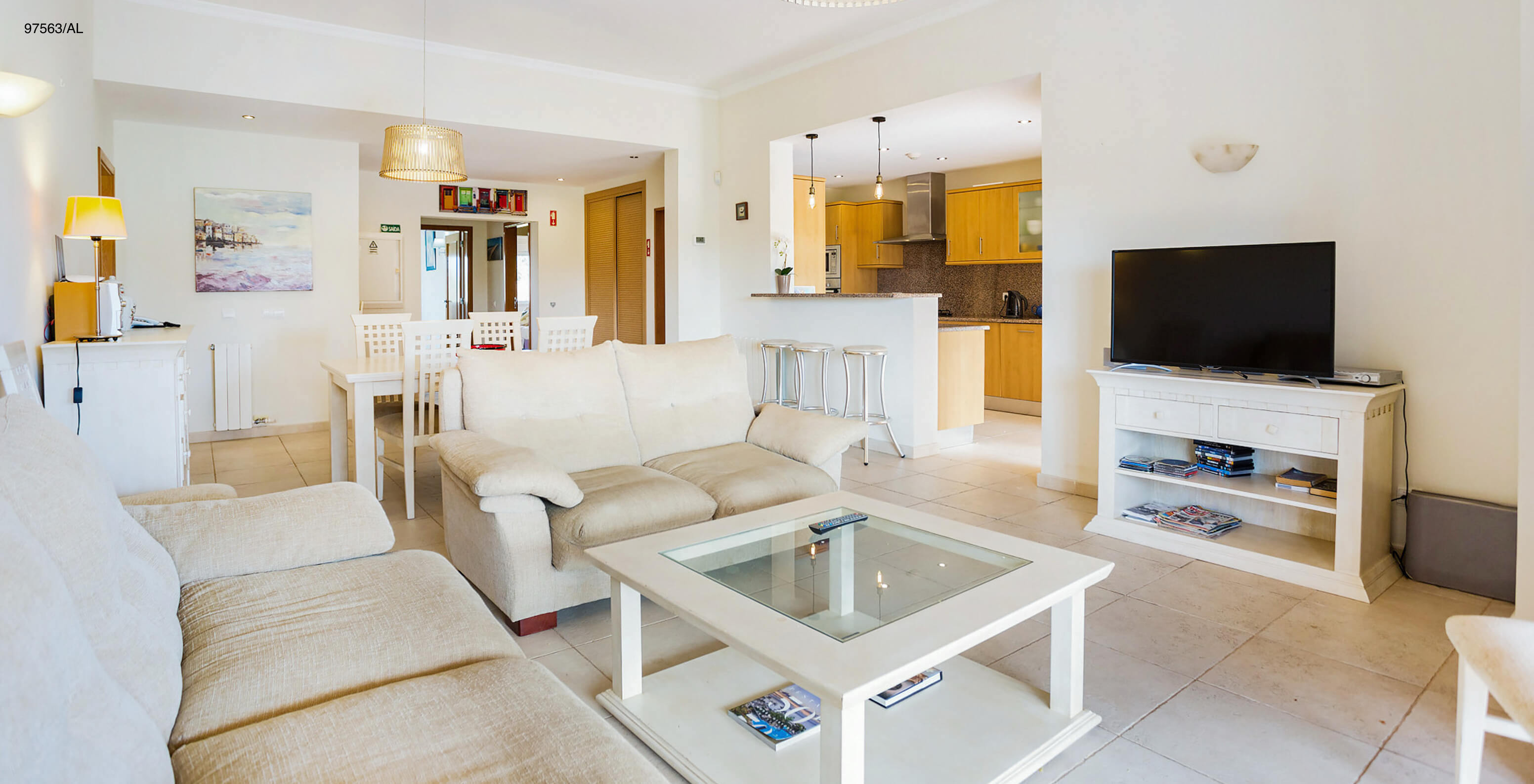 The Pestana Carvoeiro Golf T3 Superior Apartment has a living room with two beige sofas, a coffee table, and TV