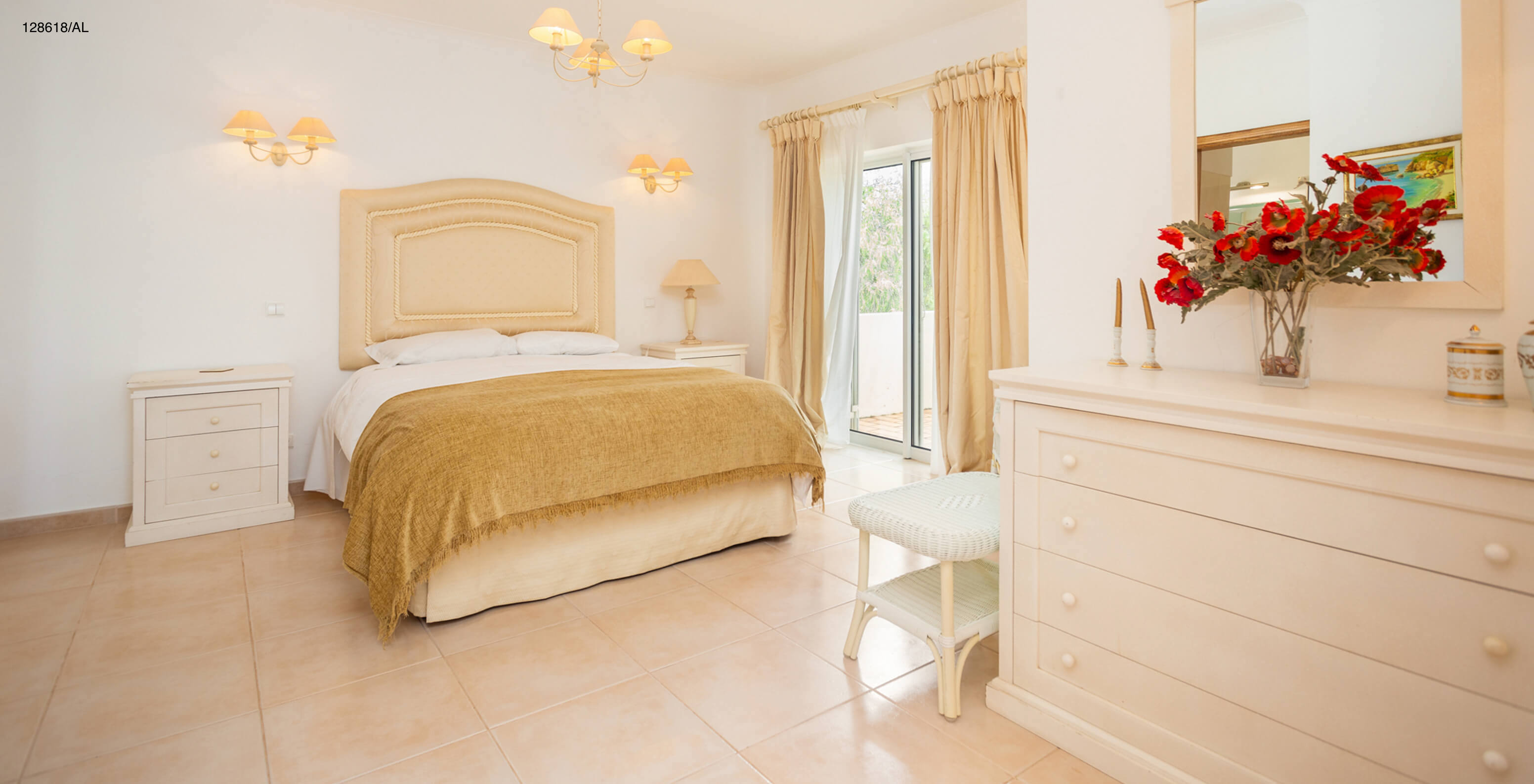 The Pestana Carvoeiro Golf V3 Superior Villa has a bedroom with a double bed, mirrors, and a window with a balcony