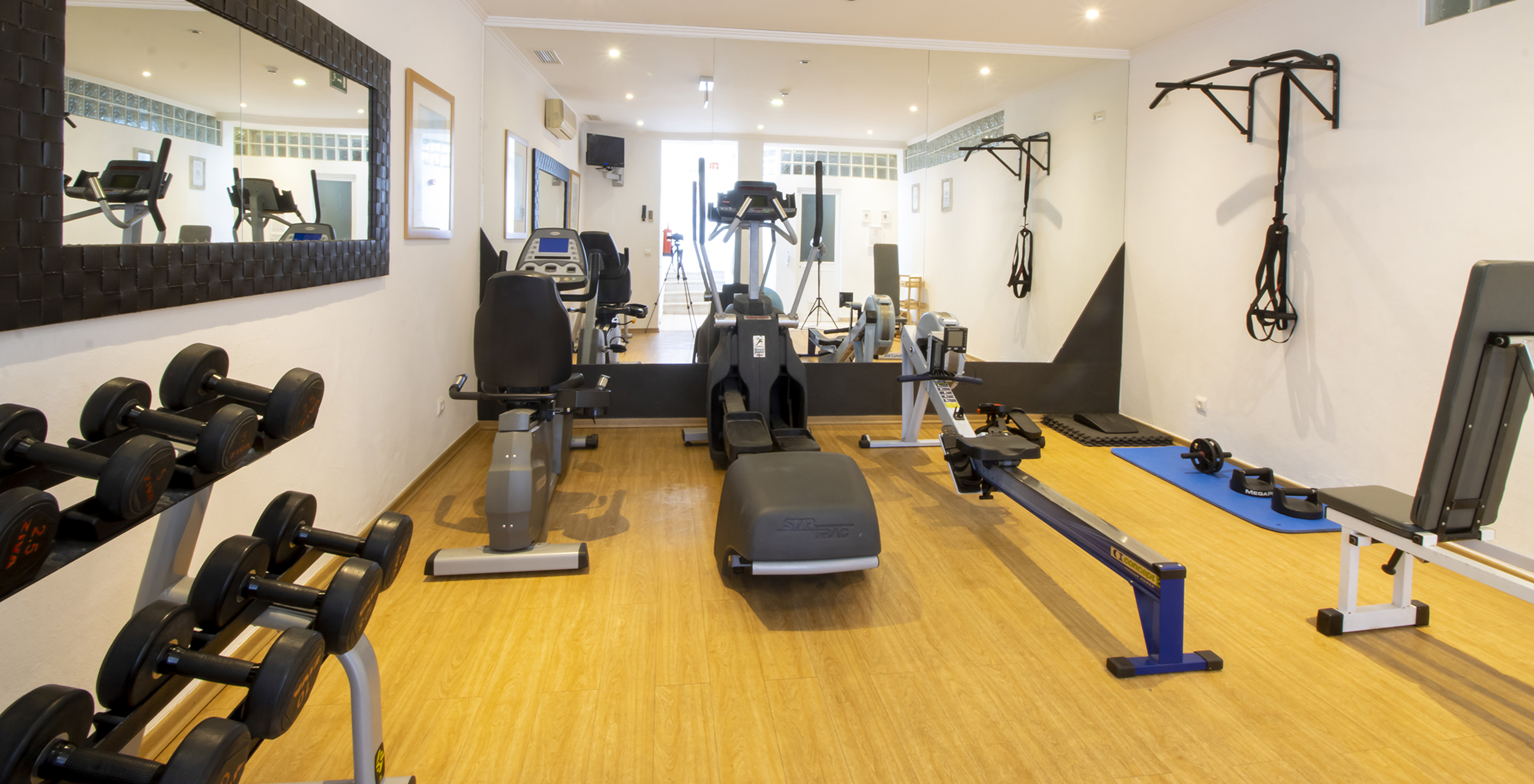 Gym at Pestana Palm Gardens with various machines to carry out your workout routine