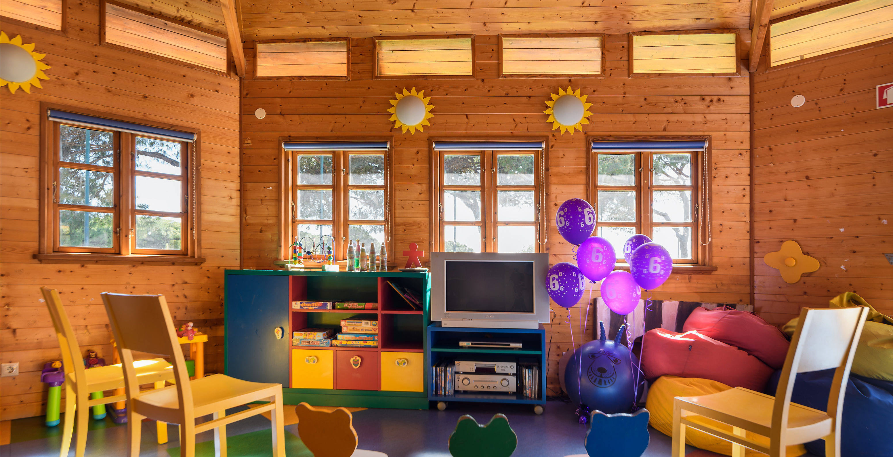 Kids Club with balloons and colorful small chairs at Pestana Vila Sol - Vilamoura, Hotel with Golf and Spa