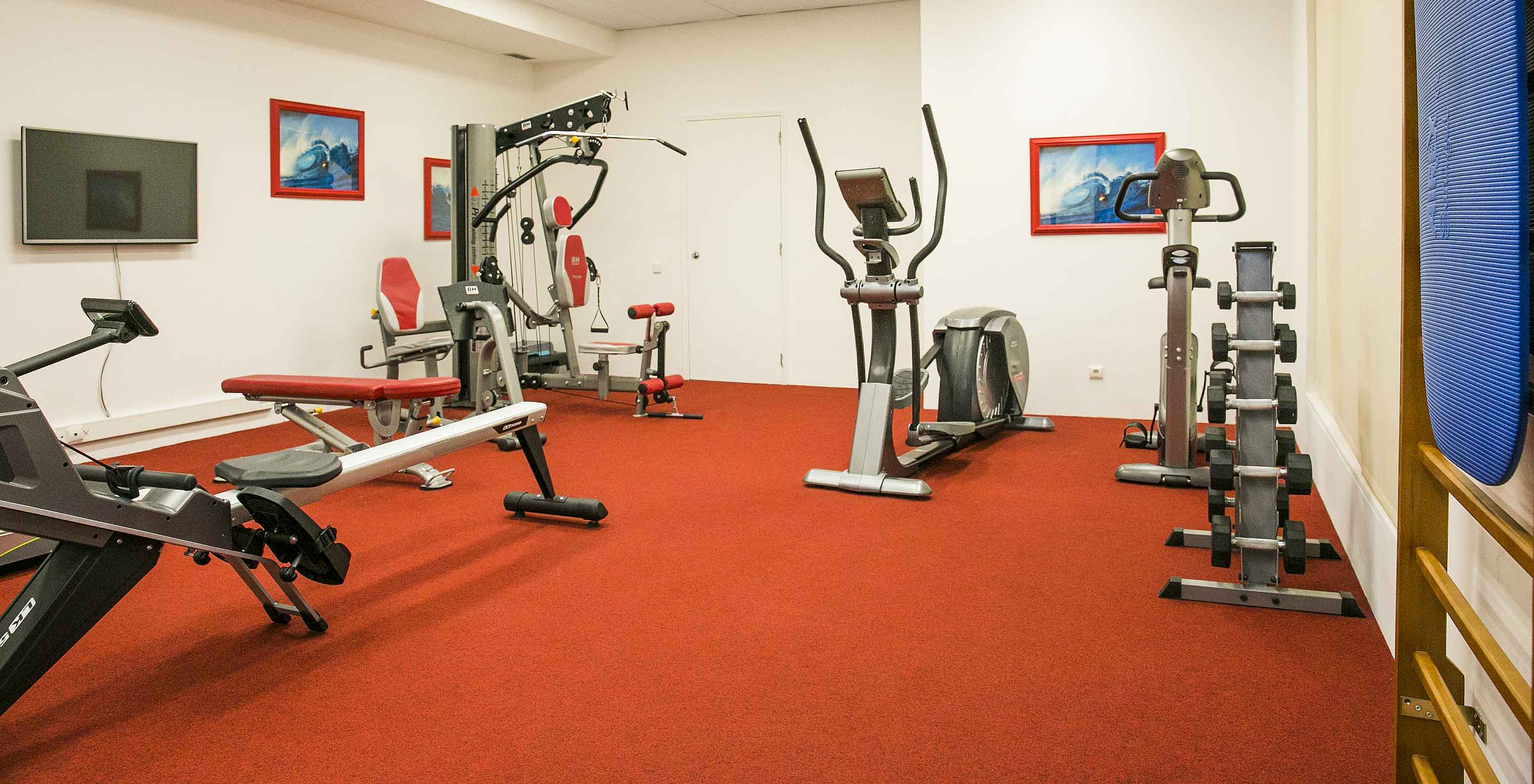 The Pestana Cascais, a hotel by the sea with a pool and spa, has a small gym room with machines