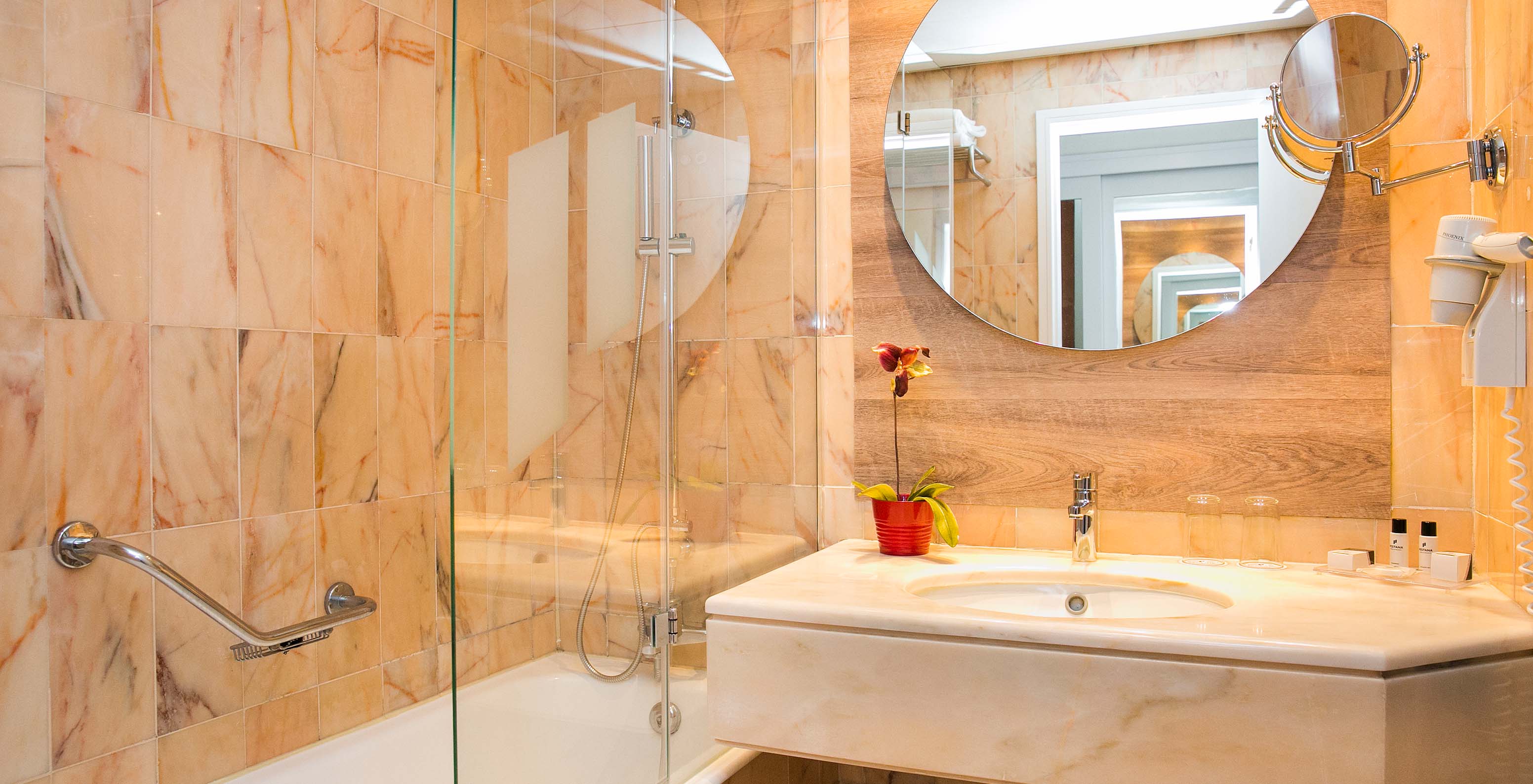 The Superior Deluxe room at Pestana Cascais has a bathroom with a mirror, sink, and bathtub