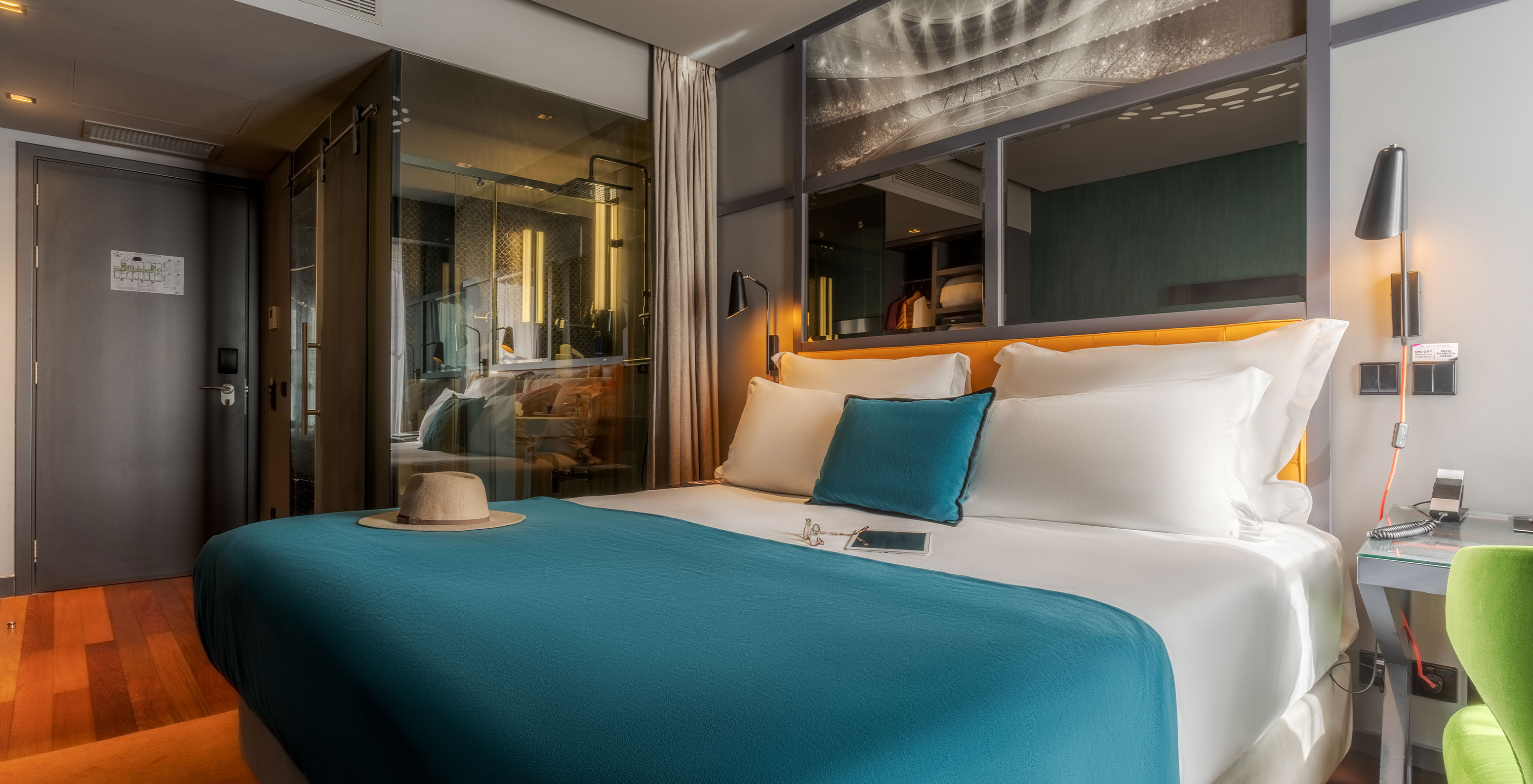 The CR7 Superior Room at Pestana CR7 Lisboa features a double bed and mirror above the bed