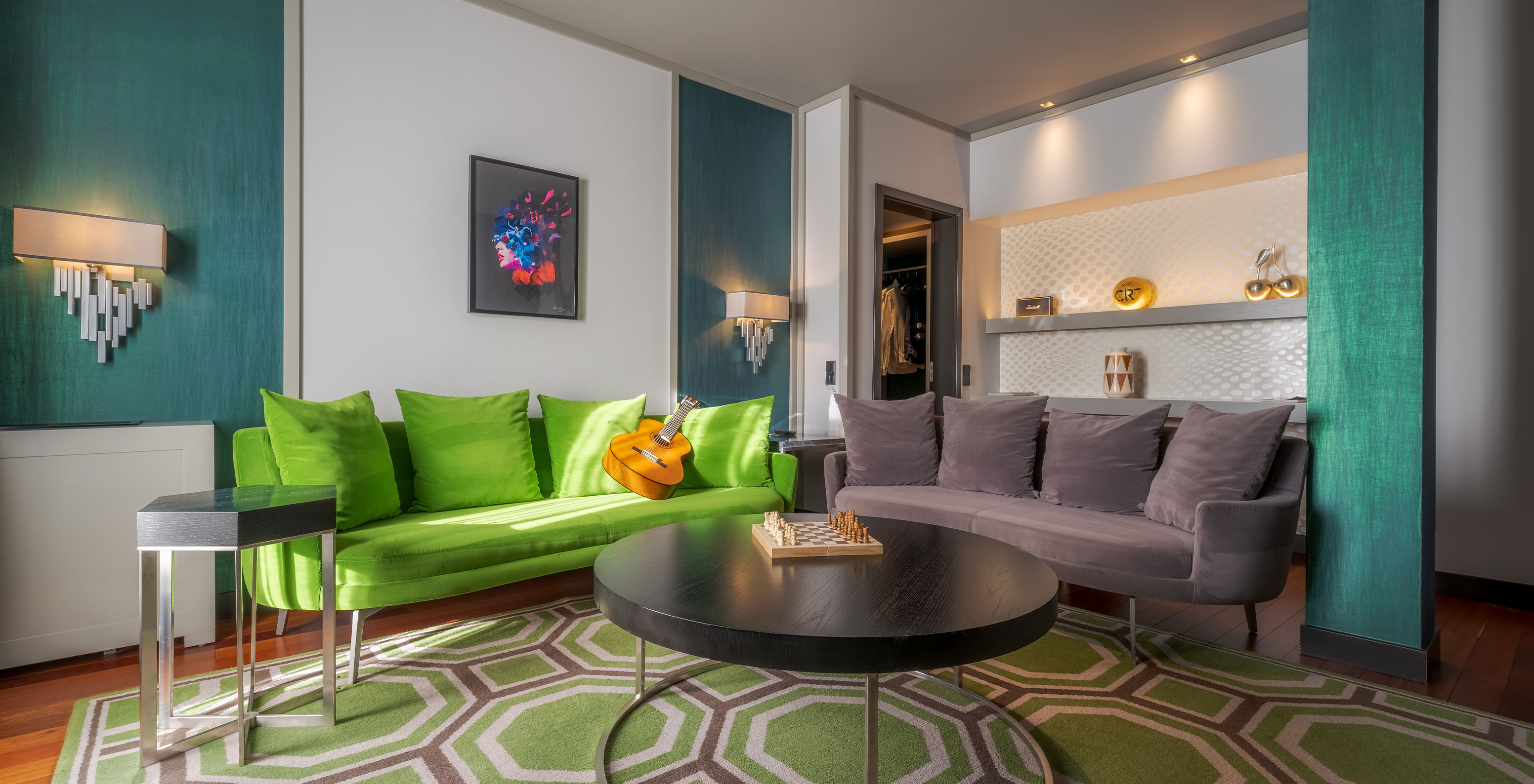 The CR7 Suite at Pestana CR7 Lisboa includes a sitting area with two sofas and a coffee table